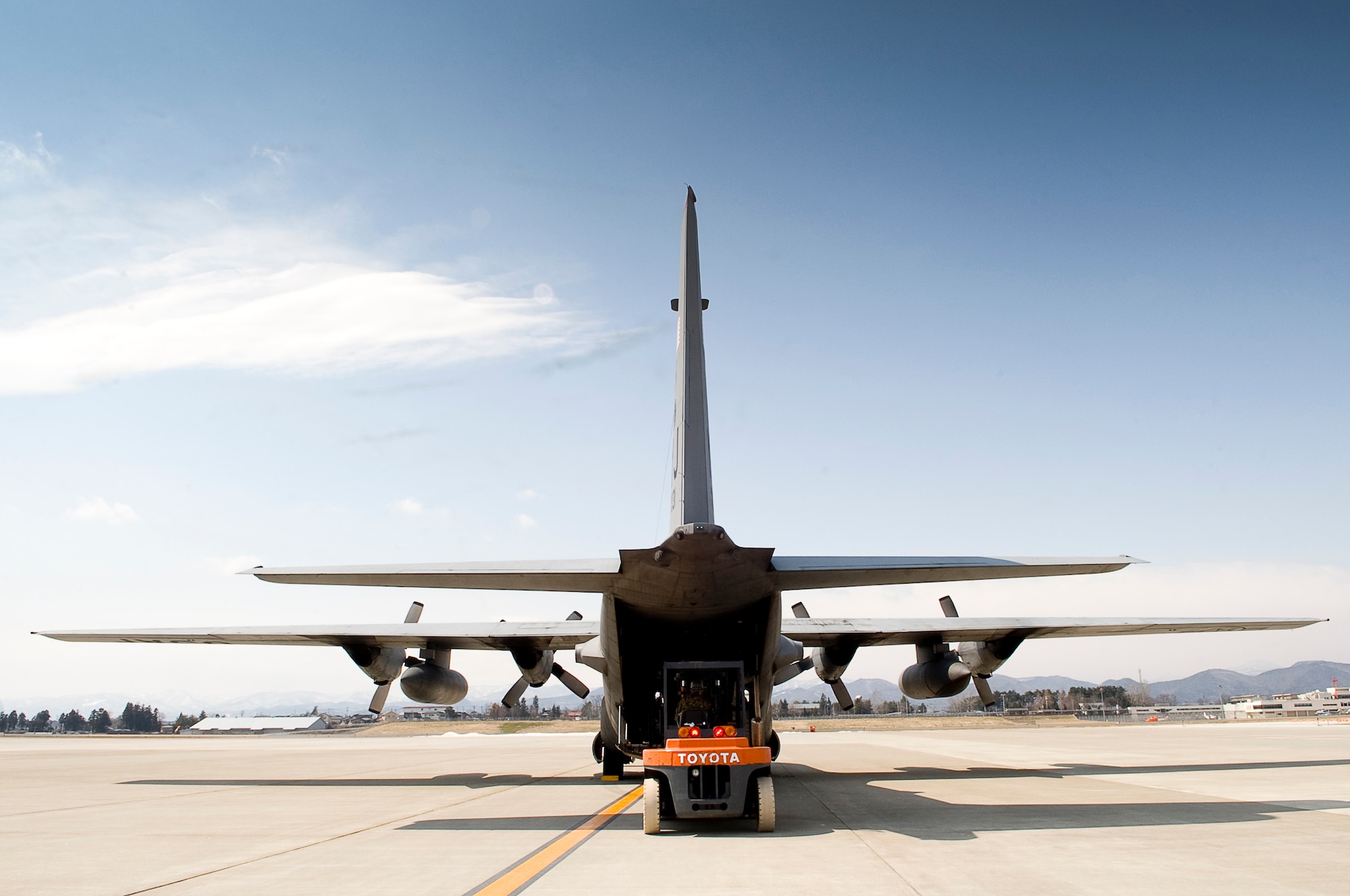 HANAMAKI AIRPORT, Japan -- A member of the Japanese Defense Force uses a forklift to unload a 36th Airlift Squadron C-130 at Hanamaki Airport, March 29. The C-130 will deliver humanitarian goods and supplies to the Japanese Defense Force in support of Operation Tomodachi. (U.S. Air Force photo by/Master Sgt. Jeromy K. Cross)





