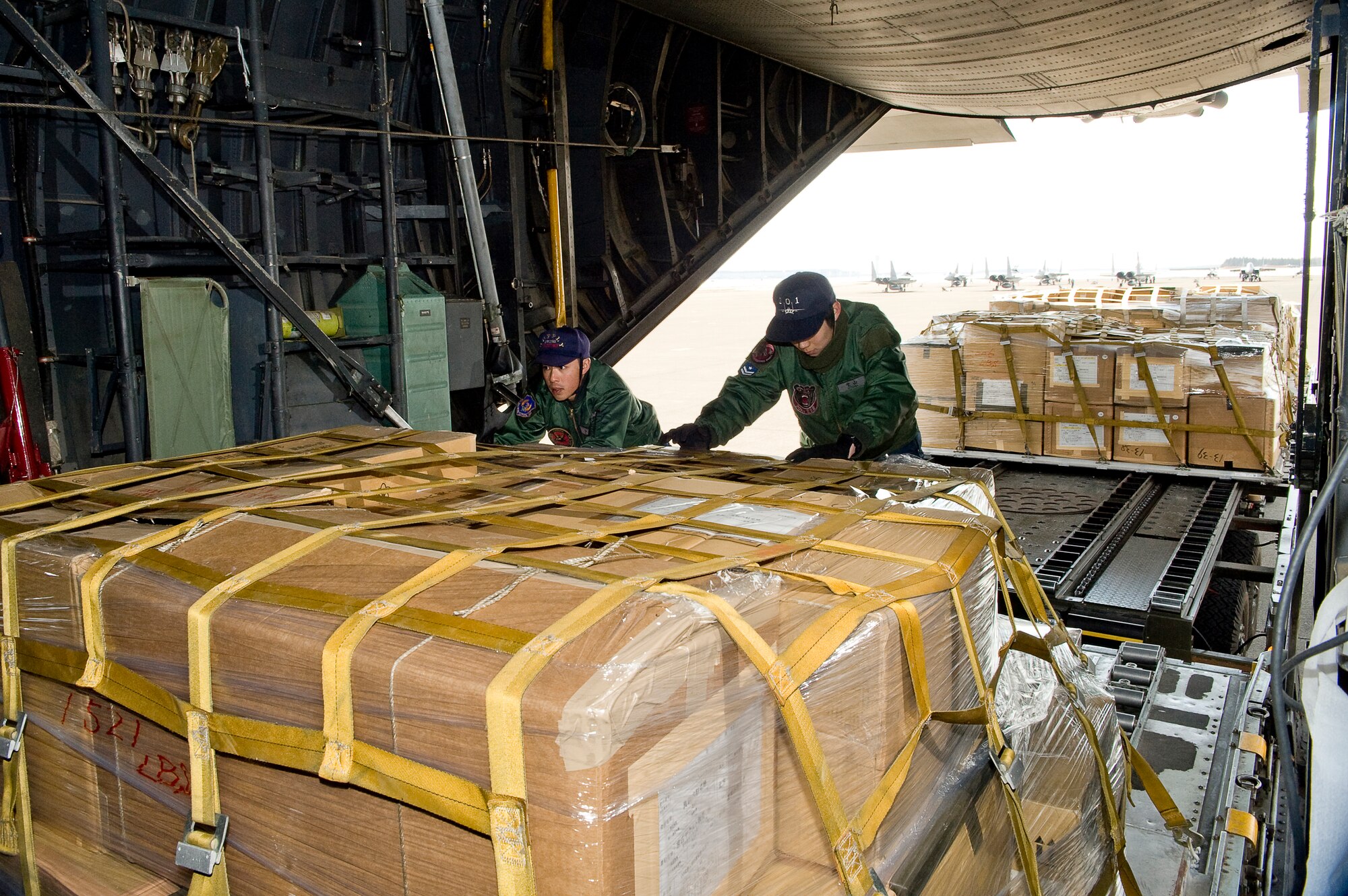 CHITOSE AIR BASE, Japan -- Members of the Japanese Defense Force load a pallet onto a 36th Airlift Squadron C-130 at Chitose Air Base, March 29. The C-130 will deliver humanitarian goods and supplies to the Japanese Defense Force in support of Operation Tomodachi. (U.S. Air Force photo by/Master Sgt. Jeromy K. Cross)






