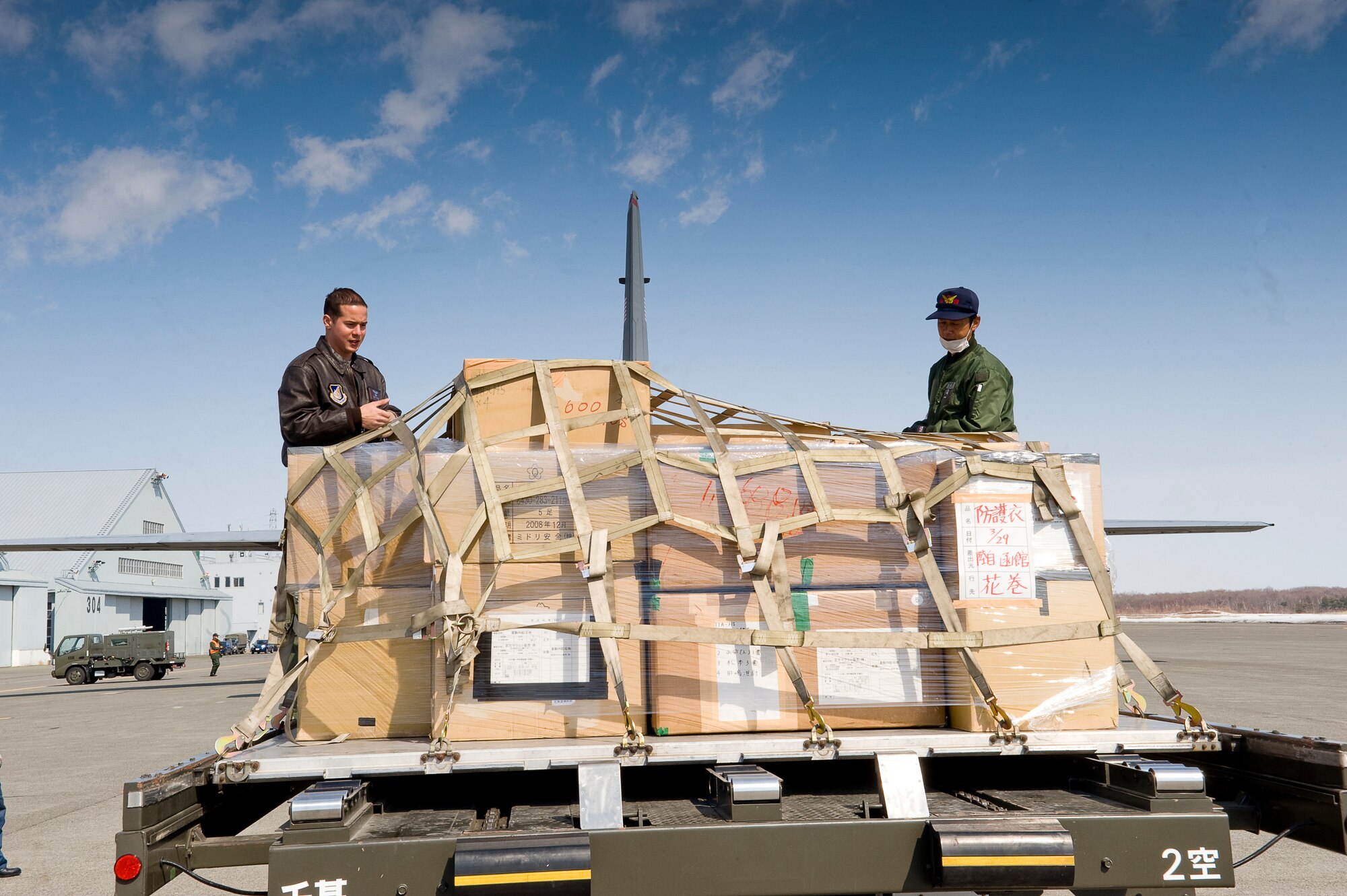 CHITOSE AIR BASE, Japan -- U.S. Air Force Staff Sgt. Nick Alarcon, 36th Airlift Squadron, and a member of the Japanese Defense Force, inspect pallets before they are loaded onto a C-130 at Chitose Air Base, March 29. Because of Yokota's long-standing working relationship with Japanese forces, Airmen are able to rapidly respond with critically needed supplies and capabilities in times of crisis. (U.S. Air Force photo by/Master Sgt. Jeromy K. Cross)






