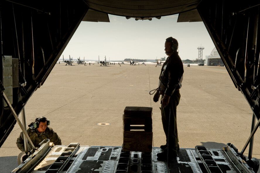 CHITOSE AIR BASE, Japan -- U.S. Air Force Staff Sgts. Steven Sheeley (left), and Nick Alarcon, 36th Airlift Squadron, prepare a C-130 Hercules to receive cargo at Chitose Air Base, March 29. The C-130 transported humanitarian goods and supplies for the Japanese Defense Force in support of Operation Tomodachi. (U.S. Air Force photo by/Master Sgt. Jeromy K. Cross)







