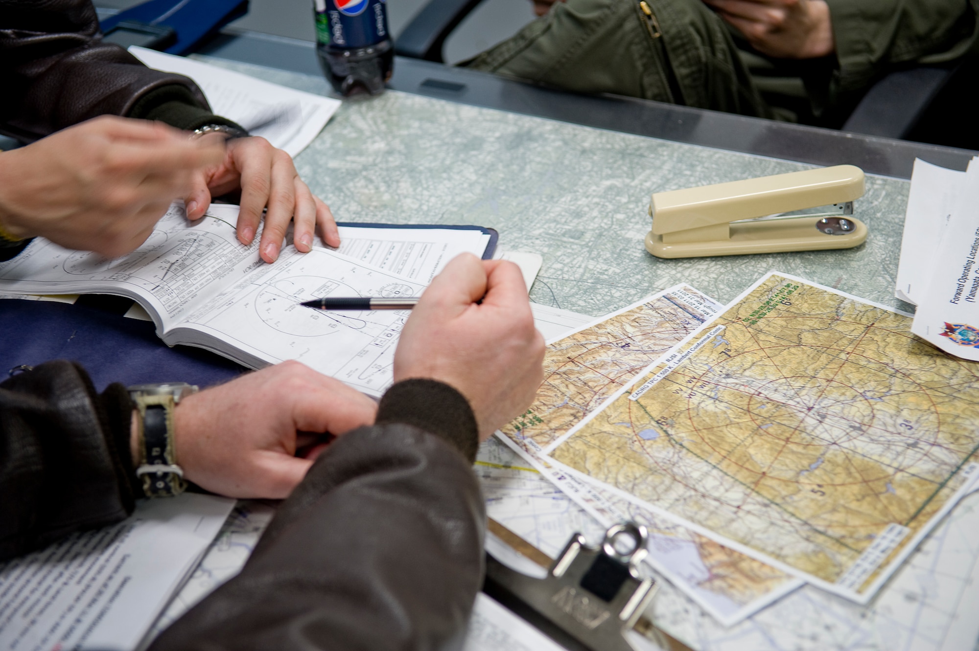 YOKOTA AIR BASE, Japan -- C-130 aircrew, from the 36th Airlift Squadron, review flight plans prior to their trip to Chitose Air Base and Hanamaki Airport, March 29. The crew is delivering humanitarian supplies to the Japanese Defense Force in support of Operation Tomodachi. (U.S. Air Force photo by/Master Sgt. Jeromy K. Cross)






