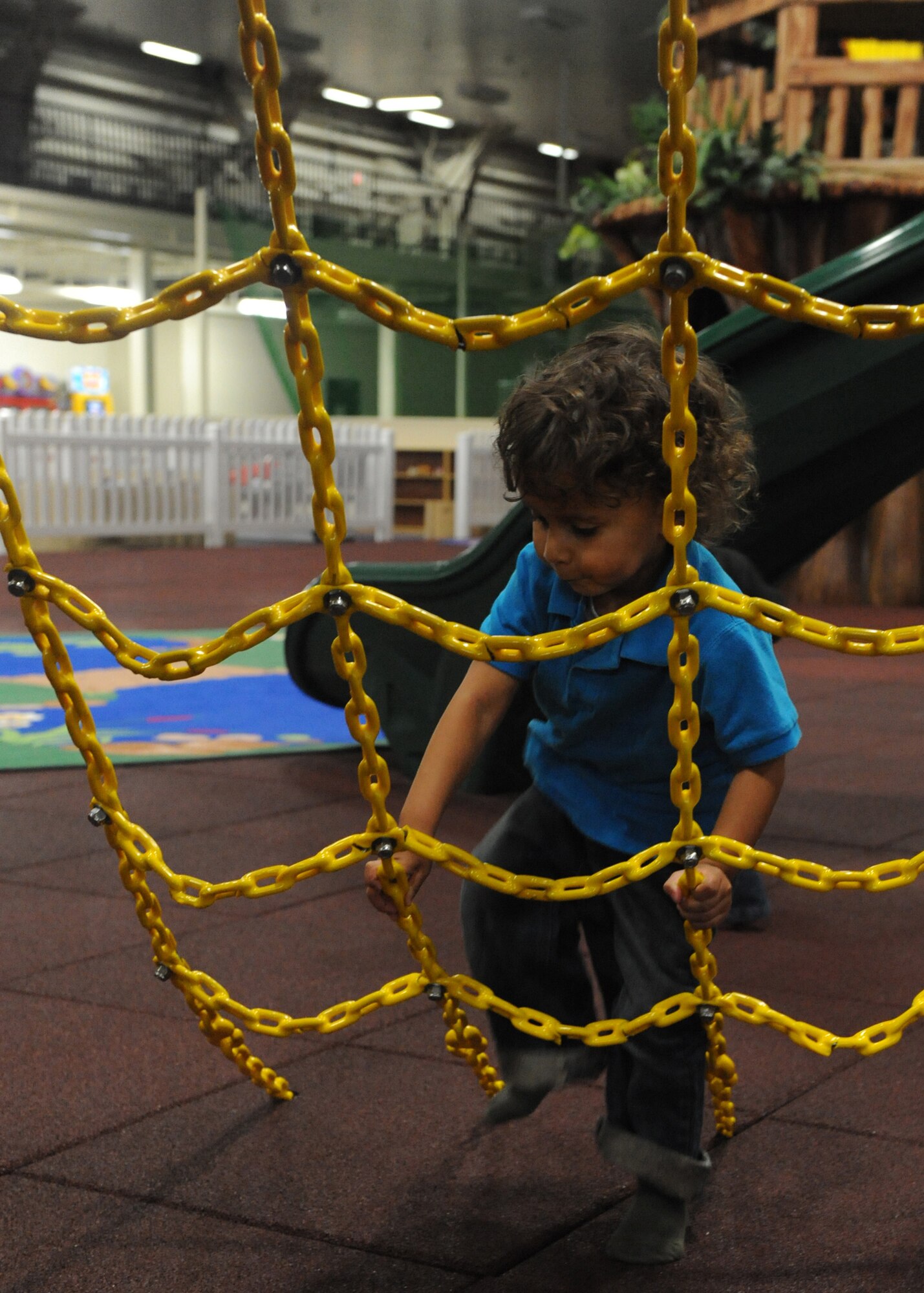 MISAWA AIR BASE, Japan – Tommy Thomas, 3 years old, climbs at the Weasel’s Den March 29. Tommy is the son of Staff Sgt. Ben Thomas, 35th Operation Support Squadron. The Weasel’s Den returns to normal business hours. Continued efforts are being made to restore the base to normal operations. (U.S. Air Force photo/ Senior Airman Chelsea Cummings)