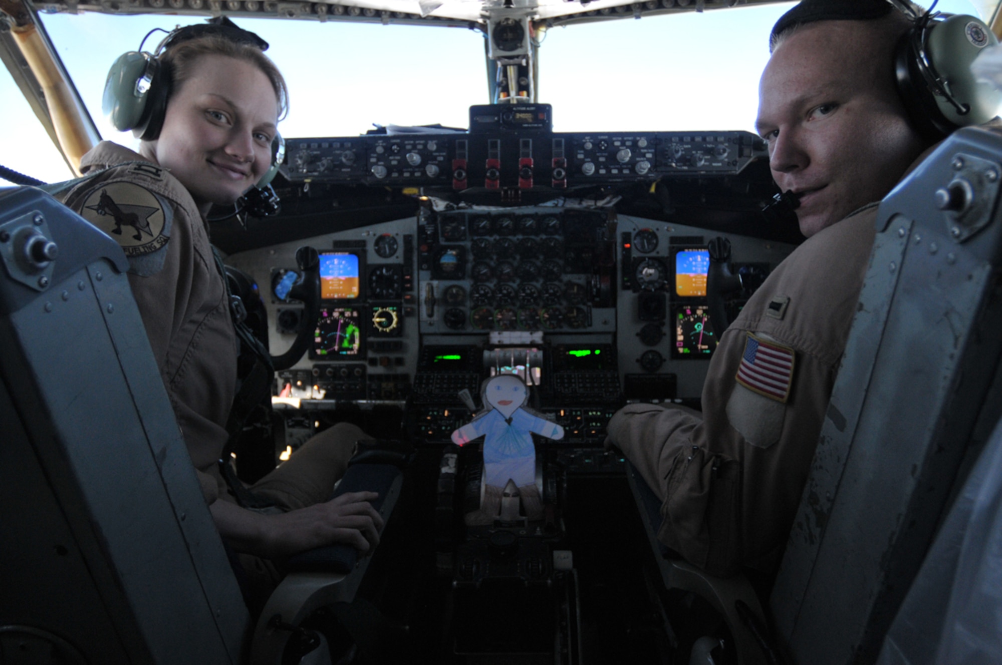 Flat Stanley takes a ride with on a KC-135 Stratotanker with Capt. Brittney Gilmer and 1st Lt. Aaron Russell, 22nd Expeditionary Air Refueling Squadron, Transit Center at Manas, Kyrgyzstan. Upon arriving at the Transit Center, Flat Stanley has been spotted participating in a number of Transit Center activities. Stanley is now safely back in his envelope and in the mail on his way home to North Carolina. (U.S. Air Force photo/Staff Sgt. Stacy Moless)