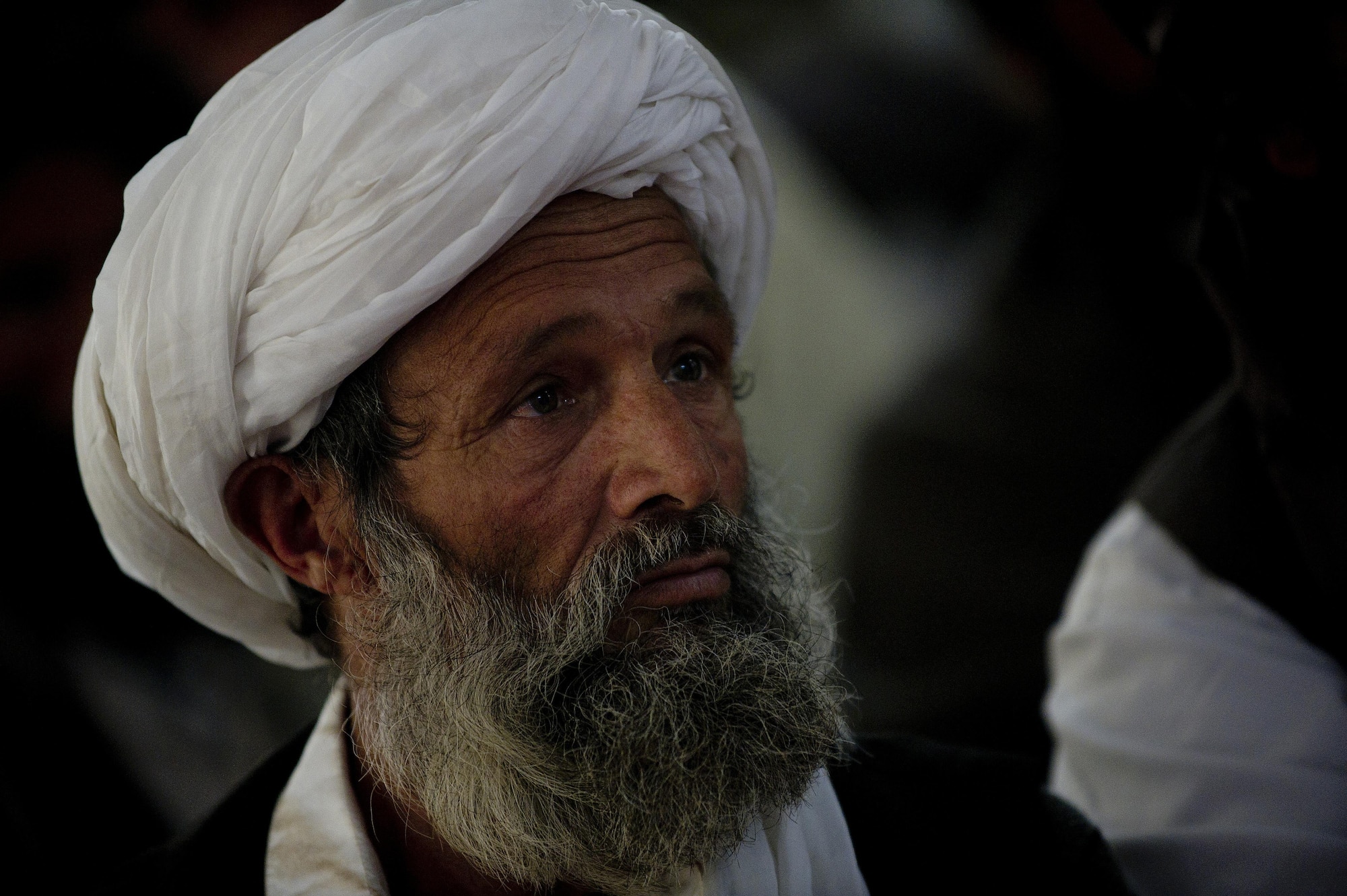 An Afghan mullah listens to other Mullah's speak during a Mullah Shura in Qalat City, Afghanistan. The Mullah Shura was a meeting of religious leaders in the Zabul province used to discuss how they can use religion to help resolve violence and fighting in Afghanistan. (U.S. Air Force photo by Master Sgt. Adrian Cadiz)