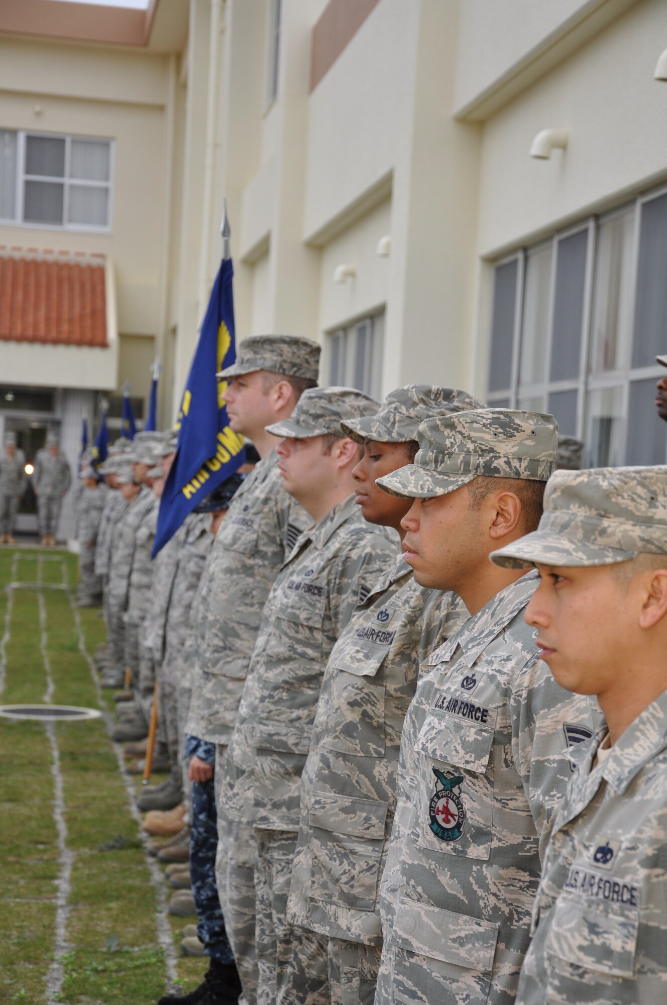 Students of Noncommissioned Officer Academy Class 11-3 form up for retreat at Kadena Air Base, Japan Mar.13.  These NCOs are the first to attend new Erwin Professional Military Education Center that opened earlier this month. (U.S. Air Force photo by Master Sgt. Geoff Robertson)