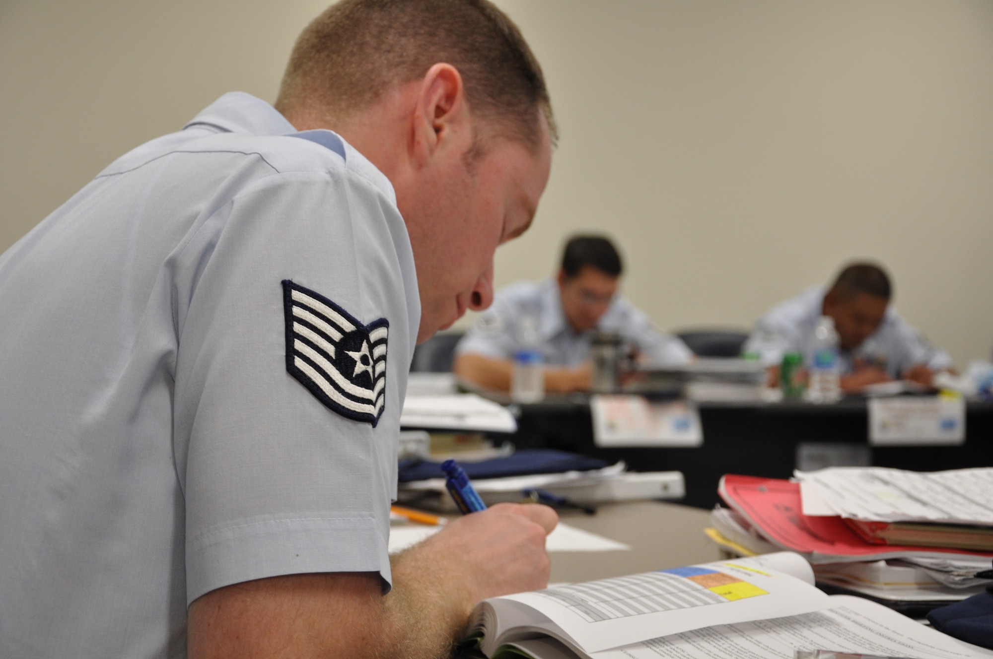 Tech. Sgt. Eric Graczyk, a student at the new Erwin Professional Military Education Center takes notes during a guided discussion about leadership influence, here Mar.13. Technical sergeants must attend the Noncommissioned Officer Academy before sewing on master sergeant. (U.S. Air Force photo by Master Sgt. Geoff Robertson)