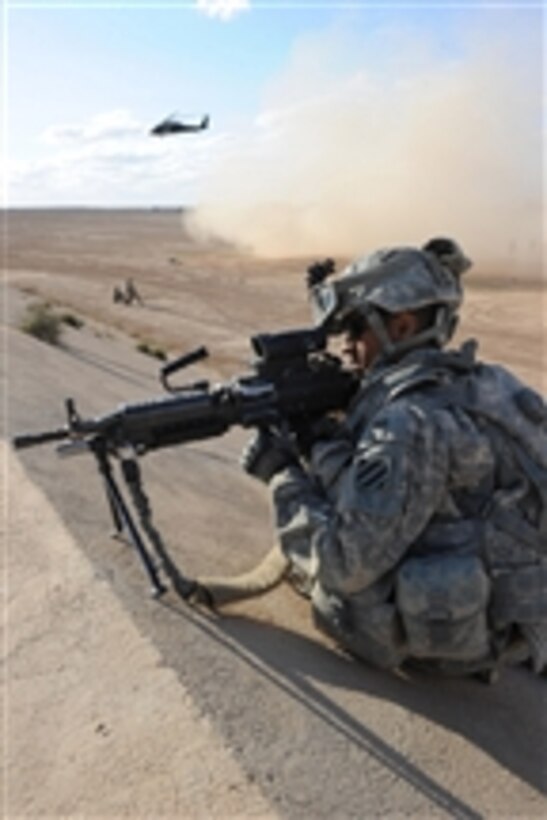 U.S. Army Pfc. Franklin Delacruz provides security for an air medical evacuation at Al Asad Airbase, Iraq, on March 11, 2011.  Delacruz is assigned to Alpha Company, 3rd Battalion, 7th Infantry Regiment, 4th Advise and Assist Brigade, 3rd Infantry Division.  Soldiers of the 4th Advise and Assist Brigade with the assistance of soldiers assigned to Charlie Company, 3rd Battalion, 126th Aviation Regiment, Massachusetts National Guard, participated in casualty evacuation training.  