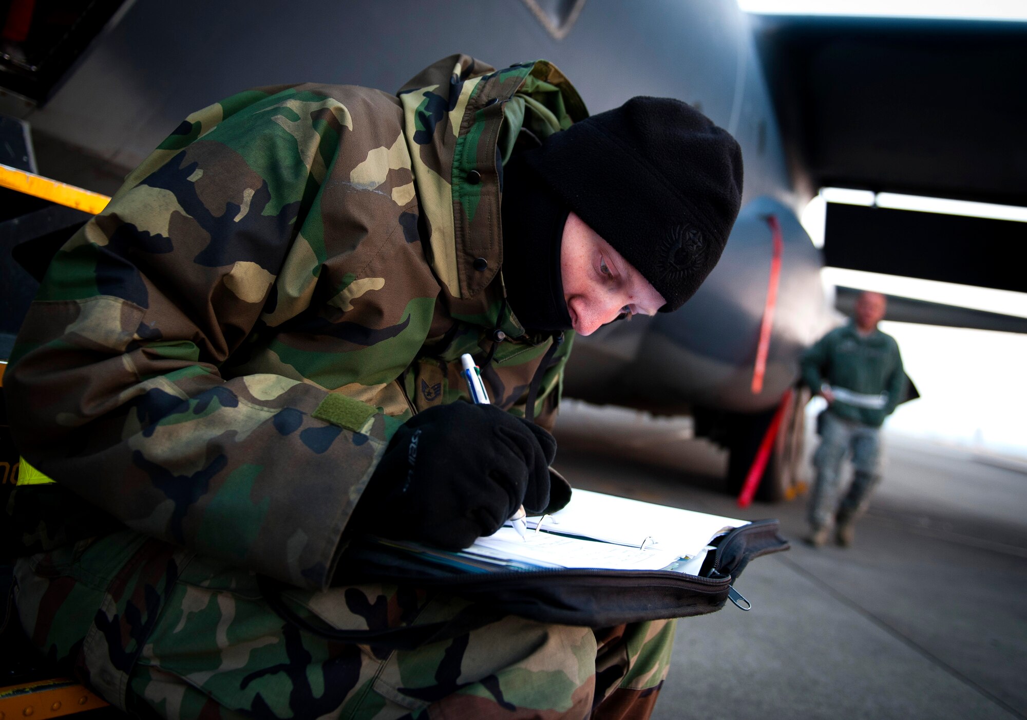 YOKOTA AIR BASE, Japan -- Staff Sgt. Daniel Wolfbauer, 353rd Special Operations Maintenance Squadron propulsions specialist, fills out paperwork after performing routine maintenance on an MC-130P Combat Shadow here March 31. As part of Operation Tomodachi, the U.S. military has humanitarian assistance capabilities positioned in the affected region that are supporting emergency relief efforts and trying to minimize human suffering. U.S. military assets include a wide range of equipment and air, sea and ground capabilities and expertise. (U.S. Air Force photo/Staff Sgt. Chad C. Strohmeyer)