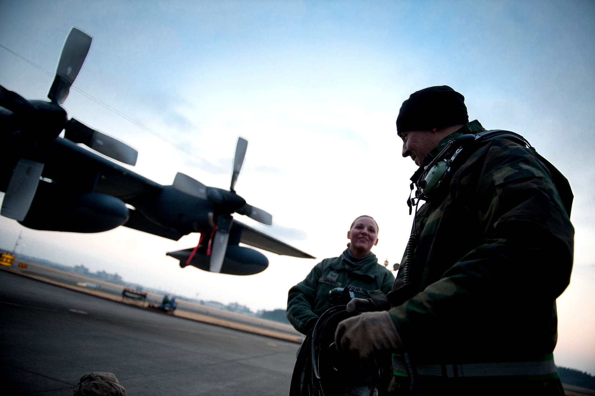 YOKOTA AIR BASE, Japan -- Airmen from the 353rd Special Operations Maintenance Squadron, discuss maintenance procedures for an MC-130P Combat Shadow here March 31. As part of Operation Tomodachi, the U.S. military has humanitarian assistance capabilities positioned in the affected region that are supporting emergency relief efforts and trying to minimize human suffering. U.S. military assets include a wide range of equipment and air, sea and ground capabilities and expertise. (U.S. Air Force photo/Staff Sgt. Chad C. Strohmeyer)