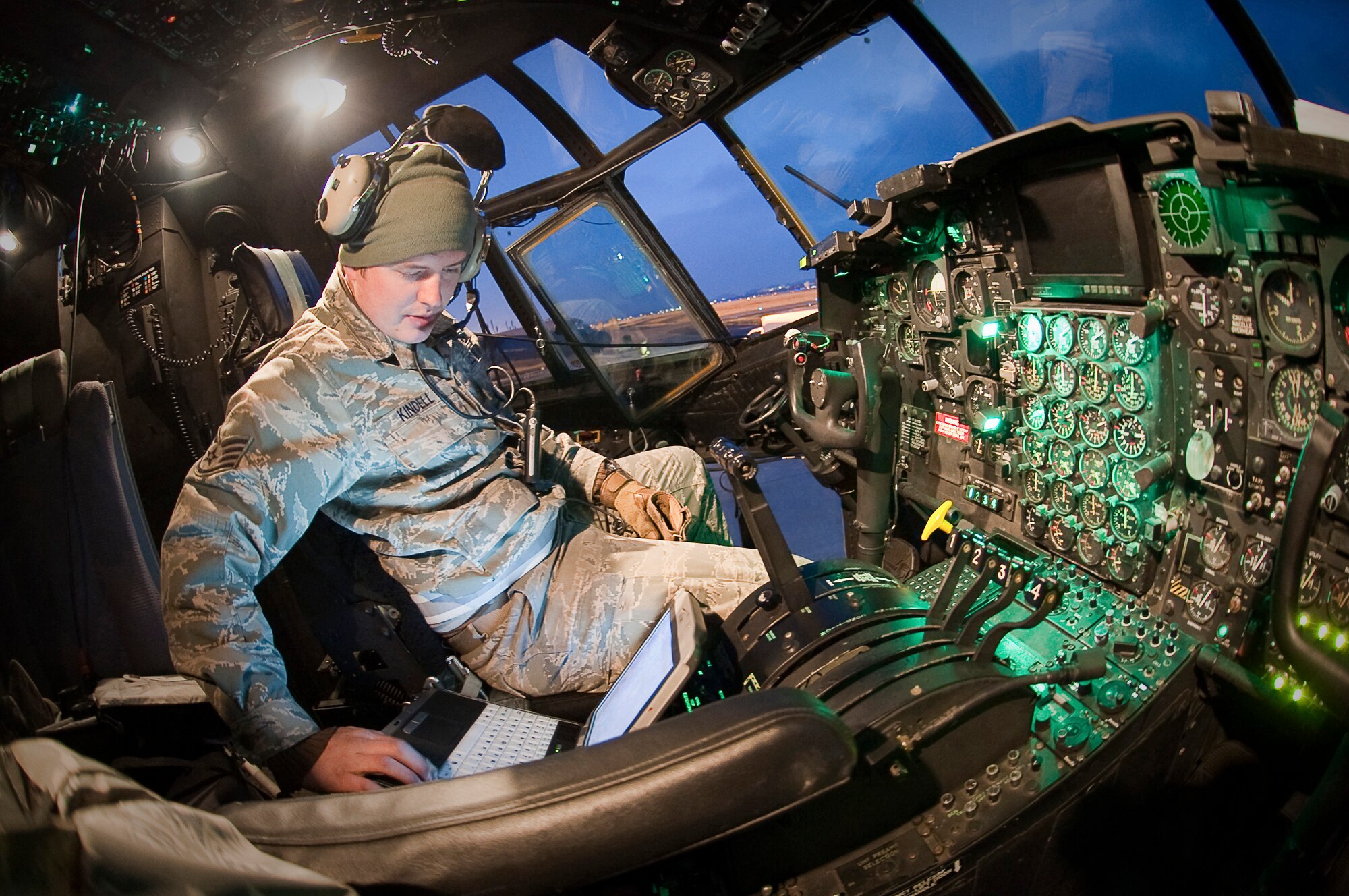 YOKOTA AIR BASE, Japan -- Staff Sgt. Jack Kindell, 353rd Special Operations Maintenance Squadron crew chief, reviews an electronic technical order prior to moving an MC-130P Combat Shadow across the flight line here March 31, 2011. The Cheboygan, Mich., native is stationed in Japan and is currently supporting Operation Tomodachi, which kicked off at the request of the Government of Japan to support humanitarian relief efforts for those affected by the earthquake tsunami disaster March 11. (U.S. Air Force photo/Airman 1st Class Andrea Salazar)