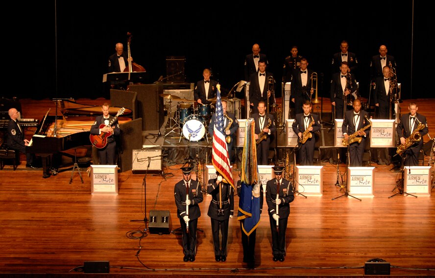 From left to right, Airman 1st Class Kenneth Snow, Staff Sgt. Jesse Schierloh, Senior Airman Ryan Nelson and Airman 1st Class Brent Dutcher, members of The U.S. Air Force Honor Guard color guard, present the colors March 25 at the University of Mississippi in Oxford, Miss. The color guard travels with the U.S. Air Force Band’s Airmen of Note ensemble to present the colors at each performance. (U.S. Air Force photo by Airman 1st Class Tabitha N. Haynes)