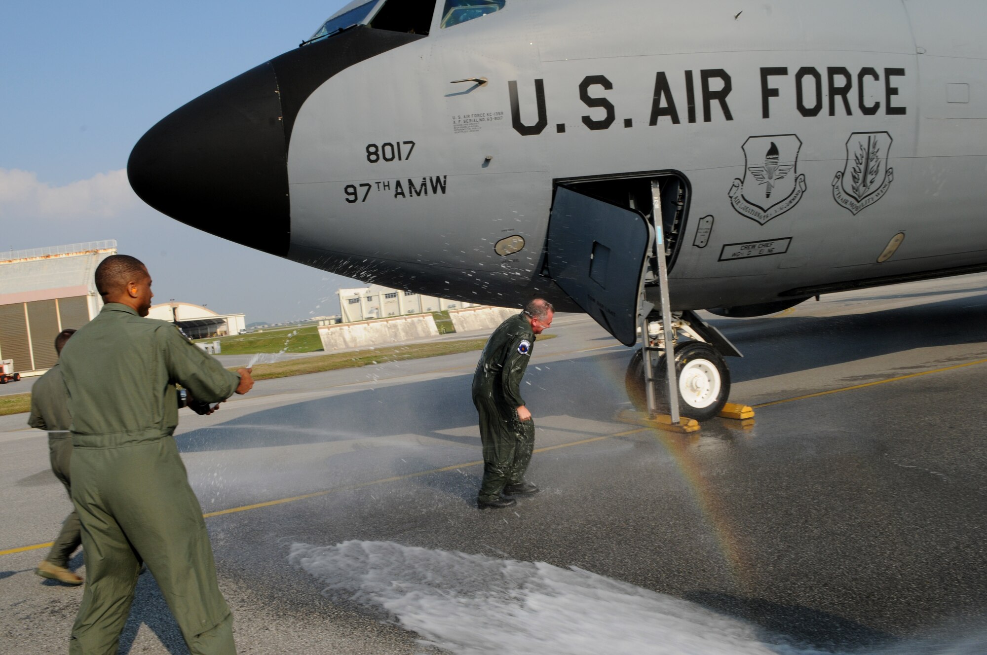 Col. Ricky Rupp. 18th Wing vice commander, gets hosed down by the wing's executive officers following his fini-flight at Kadena Air Base, March 30. Col. Rupp will command of the 22nd Air Refueling Wing at McConnell Air Force Base, Kansas this summer.  (U.S. Air Force photo /Airman 1st Class Jarvie Z. Wallace)