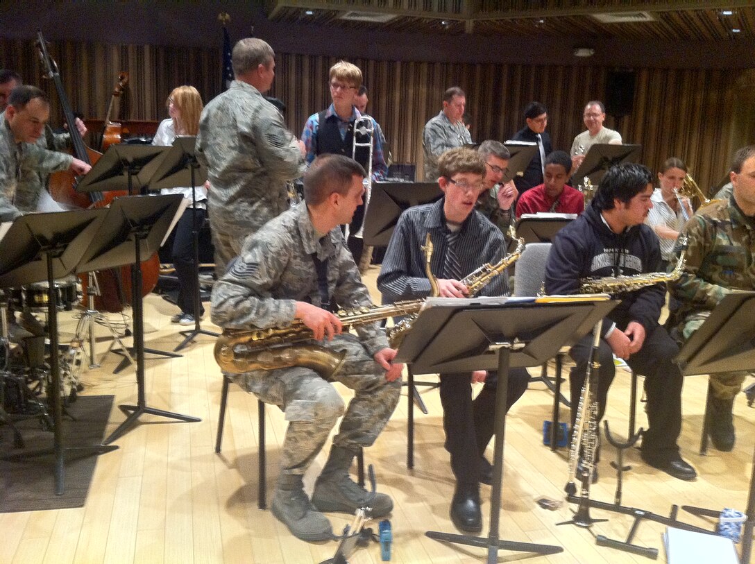 The Falconaires jazz big band works with students from Hinkley High School from Aurora, Colorado. Students spent the morning learning about musical stylings from, and playing next to, the full-time professional bandsmen from the United States Air Force Academy Band. They also learned about careers and educational opportunities available in the Air Force, and were able to see firsthand the core value of excellence being portrayed by the members of the Falconaires.