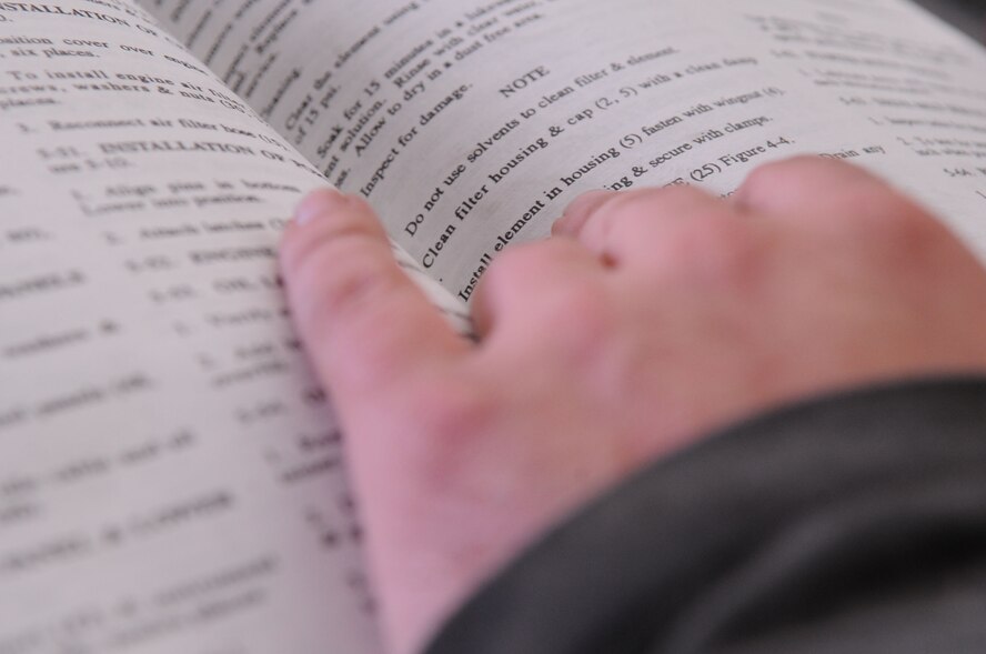 Staff Sgt. Phillip Hovey, 2nd Maintenance Squadron Aerospace Ground Equipment Flight technician, studies a technical order before performing maintenance on a hydraulic test stand March 30 at Barksdale Air Force Base. It is mandatory for AGE technicians to verify information in a technical order prior to performing maintenance on any piece of equipment. The test stand is frequently used to operate the hydraulic systems on the B-52H Stratofortress. (U.S. Air Force Photo/Staff Sgt. Terri Barriere)(RELEASED)