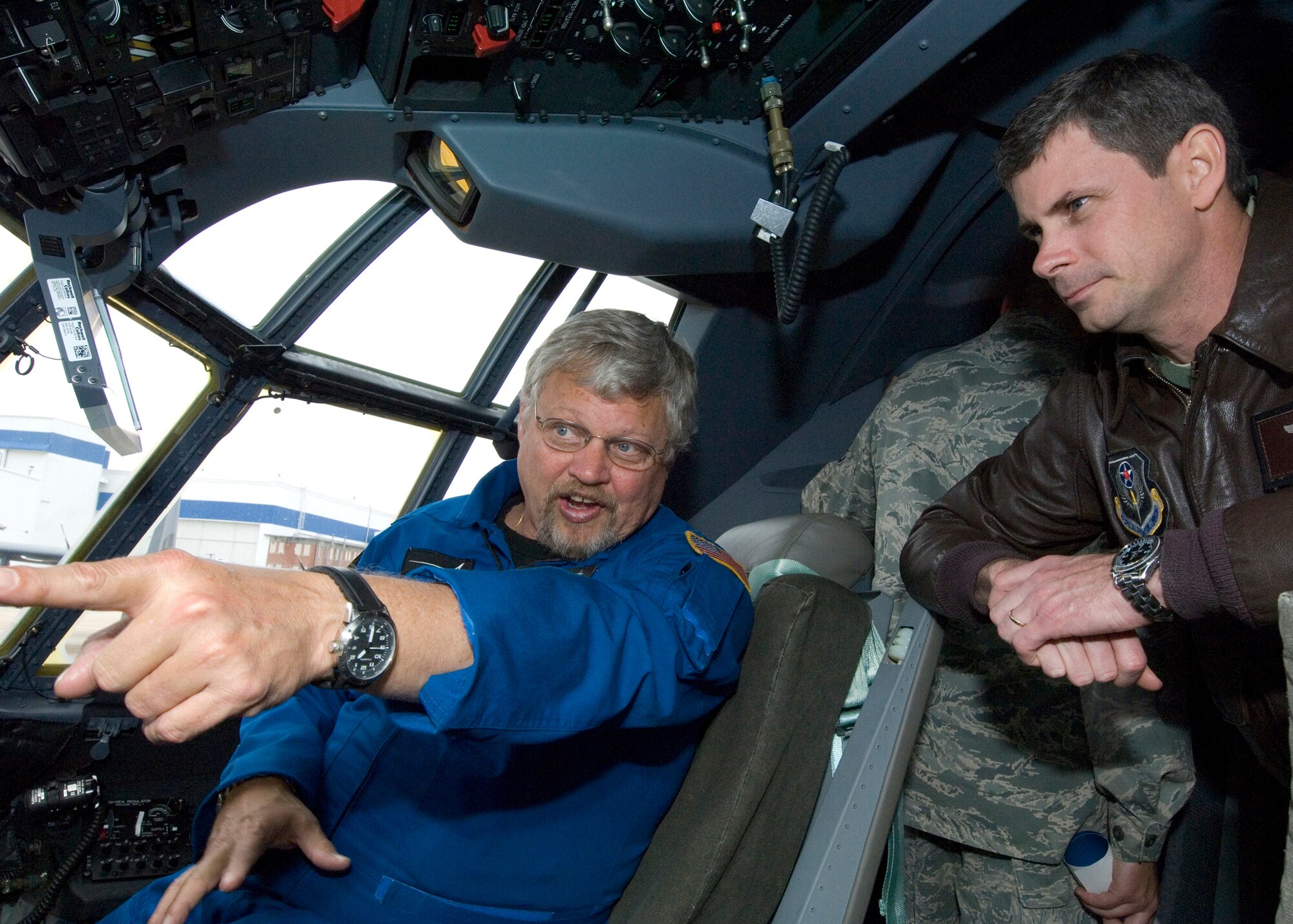 Lockheed Martin test pilot Eric Thompson shows U.S. Air Force Col. Michael Plehn, 1st Special Operations Wing commander, the cockpit of the new MC-130J, Marietta, Ga., March 29, 2011. Colonel Plehn was on hand for the unveiling ceremony of AFSOC's newest aircraft. (U.S. Air Force photo by Master Sgt. Scott MacKay/RELEASED)
