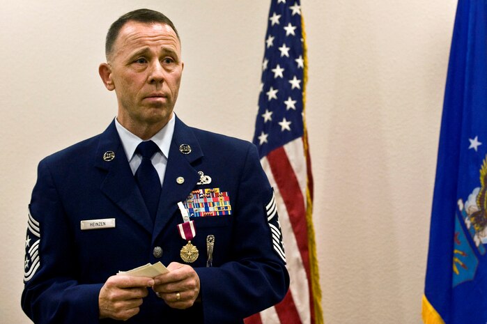 NELLIS AIR FORCE BASE, Nev.-- Chief Master Sgt. Bruce Heinzen, 57th Wing command chief master sergeant, thanks his family, friends, and co-workers during his retirement ceremony March 22. Chief Master Sgt. Heinzen has served in the Air Force for 28 years. His role as the Command Chief was as the principal advisor to the commander and senior staff members on all issues affecting over 2,500 assigned enlisted Airmen. (U.S. Air Force photo by Airman 1st Class Matthew Lancaster)