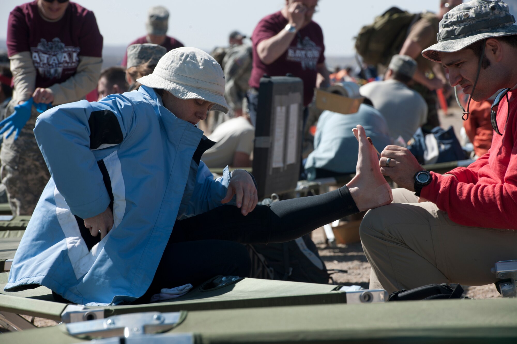 WHITE SANDS MISSILE RANGE, N.M. -- A participant of the 22nd Annual Bataan Memorial Death March receives medical attention March 27, 2011at one of seven medical stations along the 26.2-mile trail. Marchers trekked through rough terrain at elevations ranging between 4,100 and 5,300 feet. The event, attended by a record number of more than 6,000 marchers, commemorates the original Bataan Death March which occurred in the Philippines during World War II.  (U.S. Air Force photo by Airman 1st Class Joshua Turner/Released)