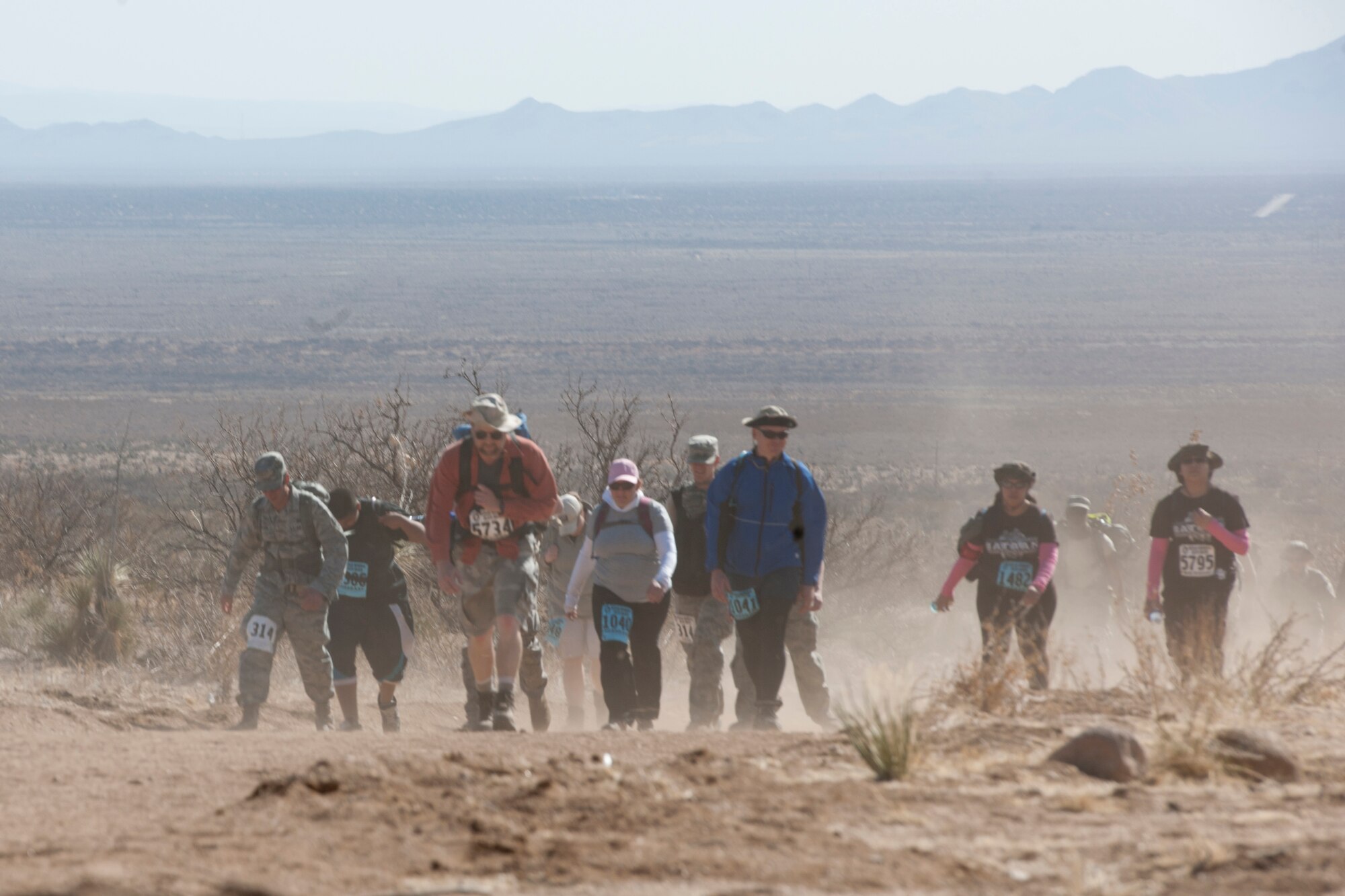 WHITE SANDS MISSLE RANGE, N.M. -- Members of the 22nd Annual Bataan Memorial Death trek through the 26.2-mile desert trail March 27, 2011. The event, attended by a record number of more than 6,000 marchers, commemorates the original Bataan Death March which occurred in the Philippines during World War II. (U.S. Air Force photo by Airman 1st Class Joshua Turner/Released)