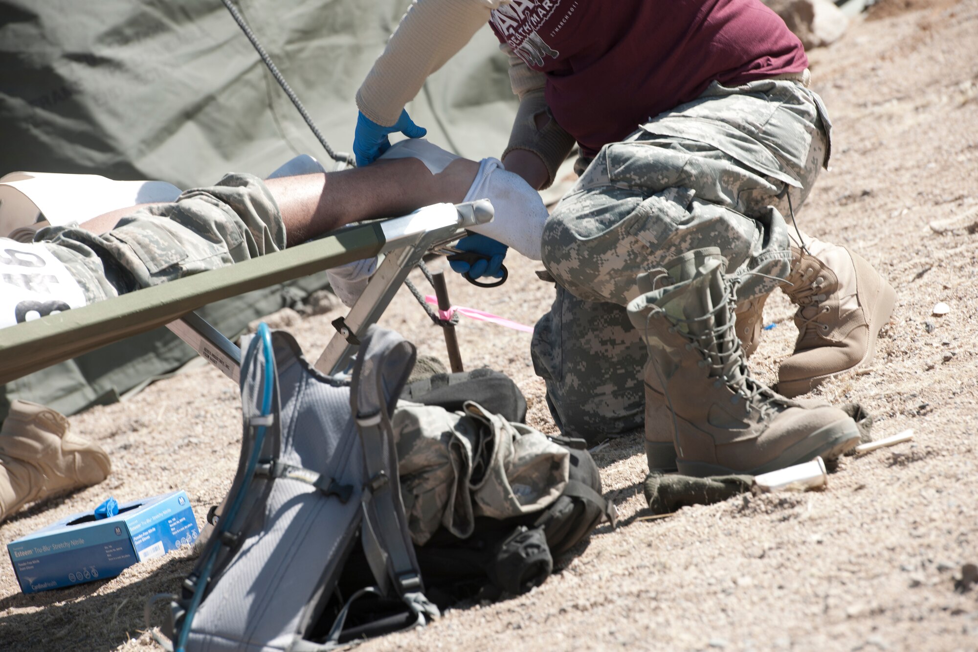 WHITE SANDS MISSILE RANGE, N.M. -- A participant of the 22nd Annual Bataan Memorial Death March receives medical attention March 27, 2011 at one of seven medical stations along the 26.2-mile trail. Marchers trekked through rough terrain at elevations ranging between 4,100 and 5,300 feet. The event, attended by a record number of more than 6,000 marchers, commemorates the original Bataan Death March which occurred in the Philippines during World War II.  (U.S. Air Force photo by Airman 1st Class Joshua Turner/Released)