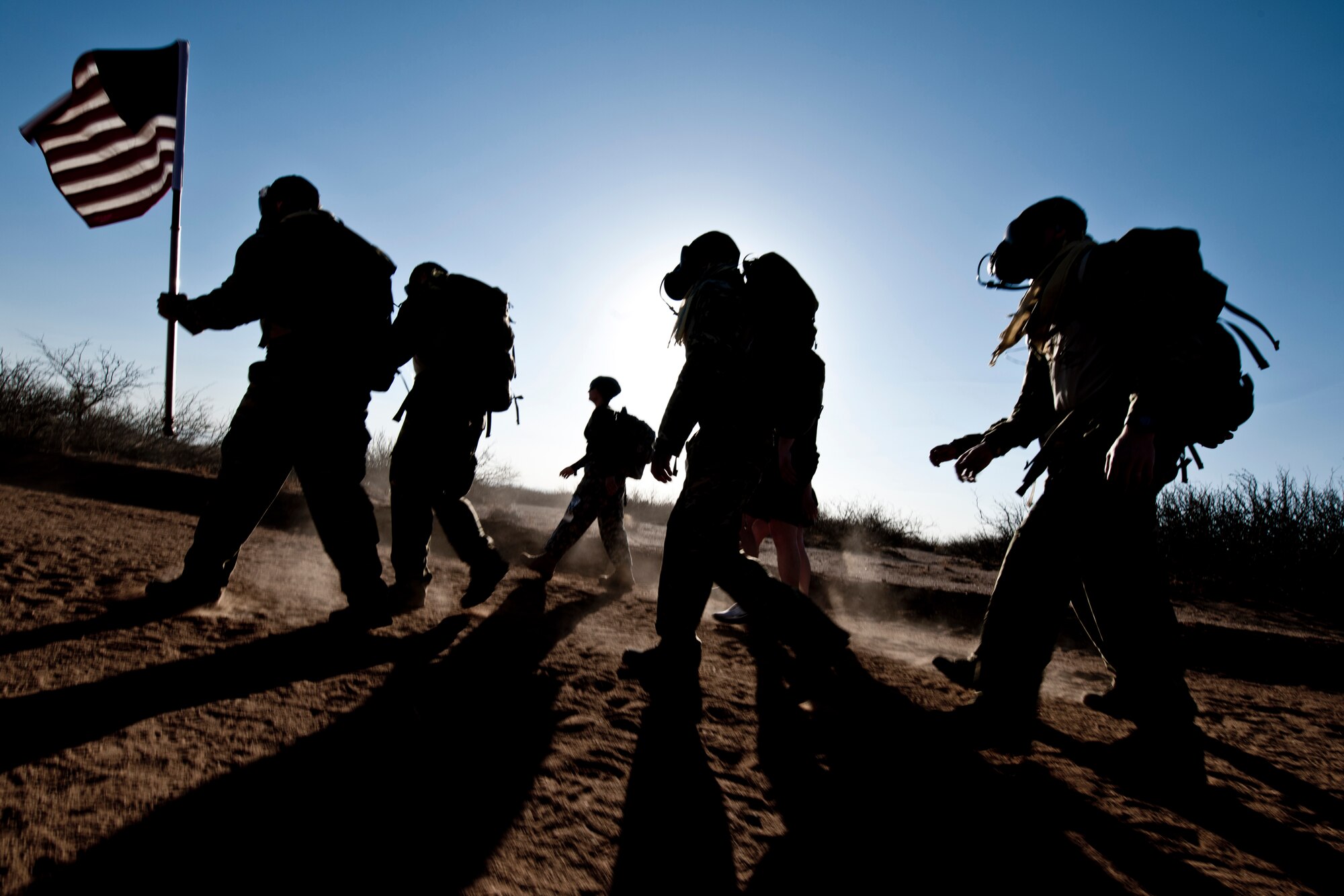 WHITE SANDS MISSILE RANGE, N.M. -- Participants of the 22nd Annual Bataan Memorial Death March imprint their footprints on the 26.2-mile desert trail March 27, 2011. Marchers were able to experience, in part, what the soldiers endured during the original Bataan Death March which occurred in the Philippines during World War II. On April 9, 1942, 75,000 Army, Army Air Corps, Navy, Marines and Filipino soldiers surrendered to Japanese forces. Forced to march 60 miles in the sweltering heat through the Philippine jungles, thousands of soldiers died in transit to prisoner-of-war camps.  (U.S. Air Force photo by Airman 1st Class Joshua Turner/Released)