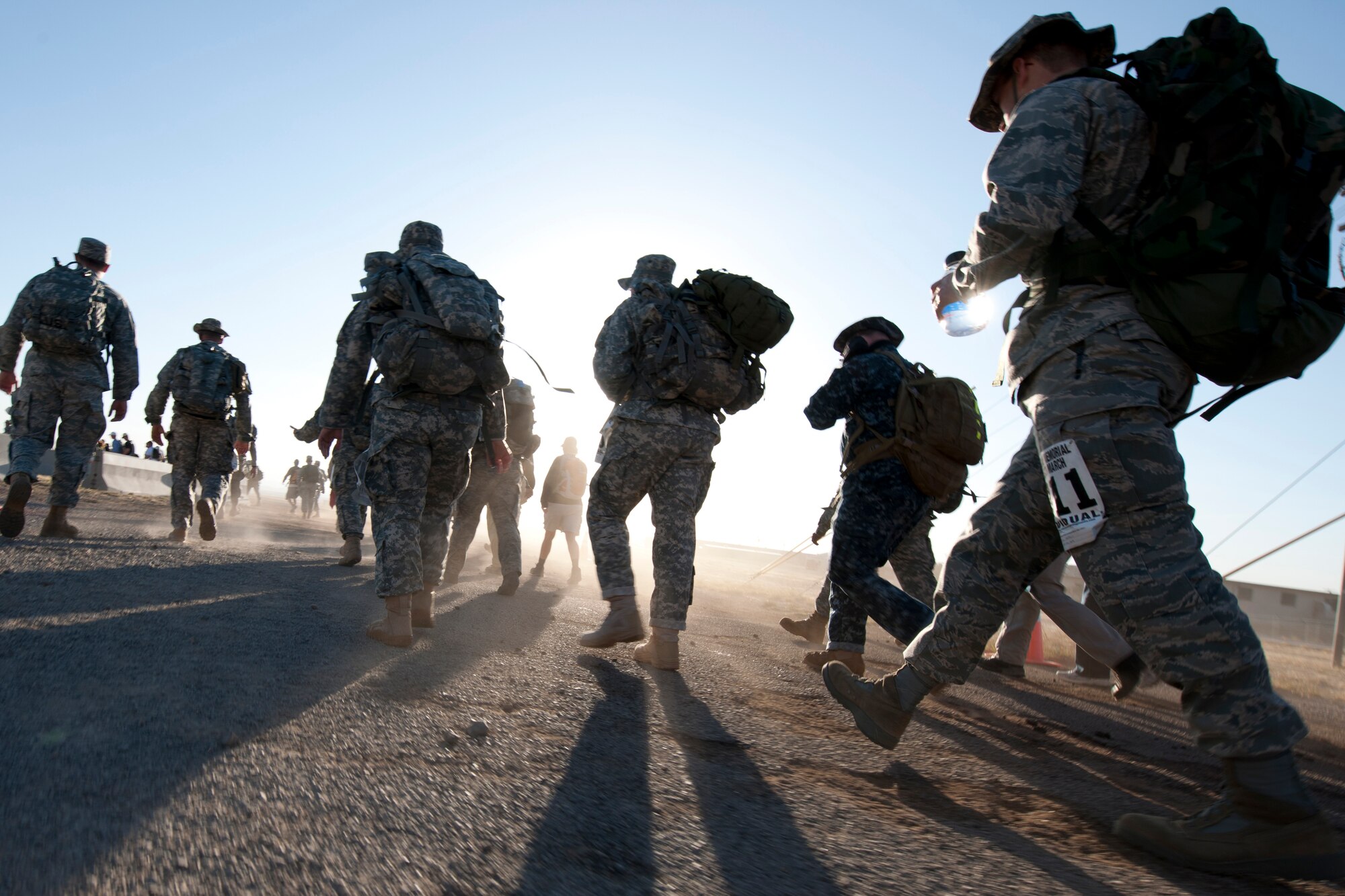 WHITE SANDS MISSILE RANGE, N.M. -- Participants of the 22nd Annual Bataan Memorial Death March imprint their footprints on the 26.2-mile desert trail March 27, 2011. The event, attended by a record number of more than 6,000 marchers, commemorates the original Bataan Death March which occurred in the Philippines during World War II. On April 9, 1942, 75,000 Army, Army Air Corps, Navy, Marines and Filipino soldiers were surrendered to Japanese forces. Forced to march 60 miles in the sweltering heat through the Philippine jungles, thousands of soldiers died in transit to prisoner-of-war camps. (U.S. Air Force photo by Airman 1st Class Joshua Turner/Released)
