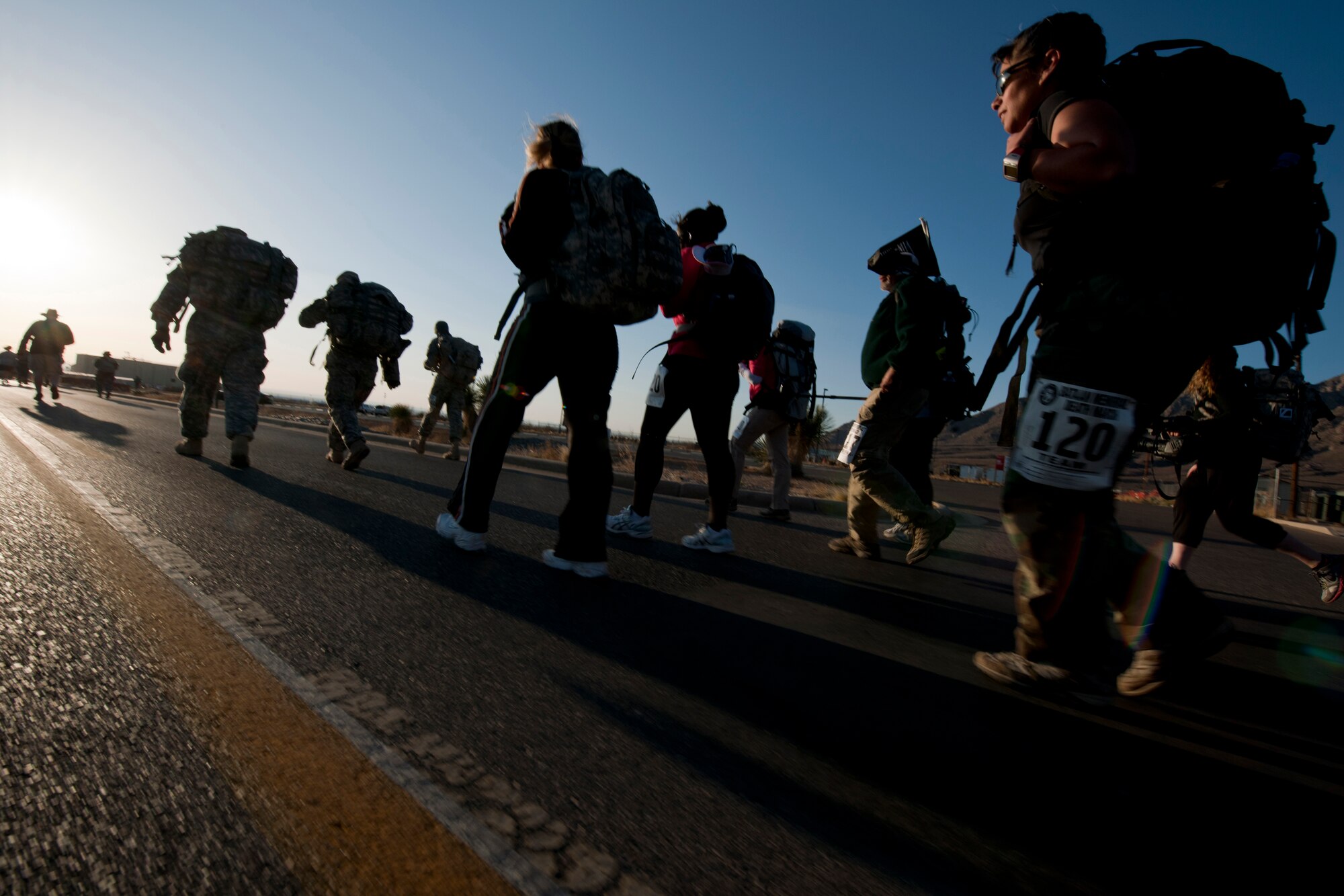 WHITE SANDS MISSLE RANGE, N.M. -- Participants of the 22nd Annual Bataan Memorial Death March trek through the first mile of the 26.2-mile trail March 27, 2011. The event, attended by a record number of more than 6,000 marchers, commemorates the original Bataan Death March which occurred in the Philippines during World War II. (U.S. Air Force photo by Airman 1st Class Joshua Turner/Released)