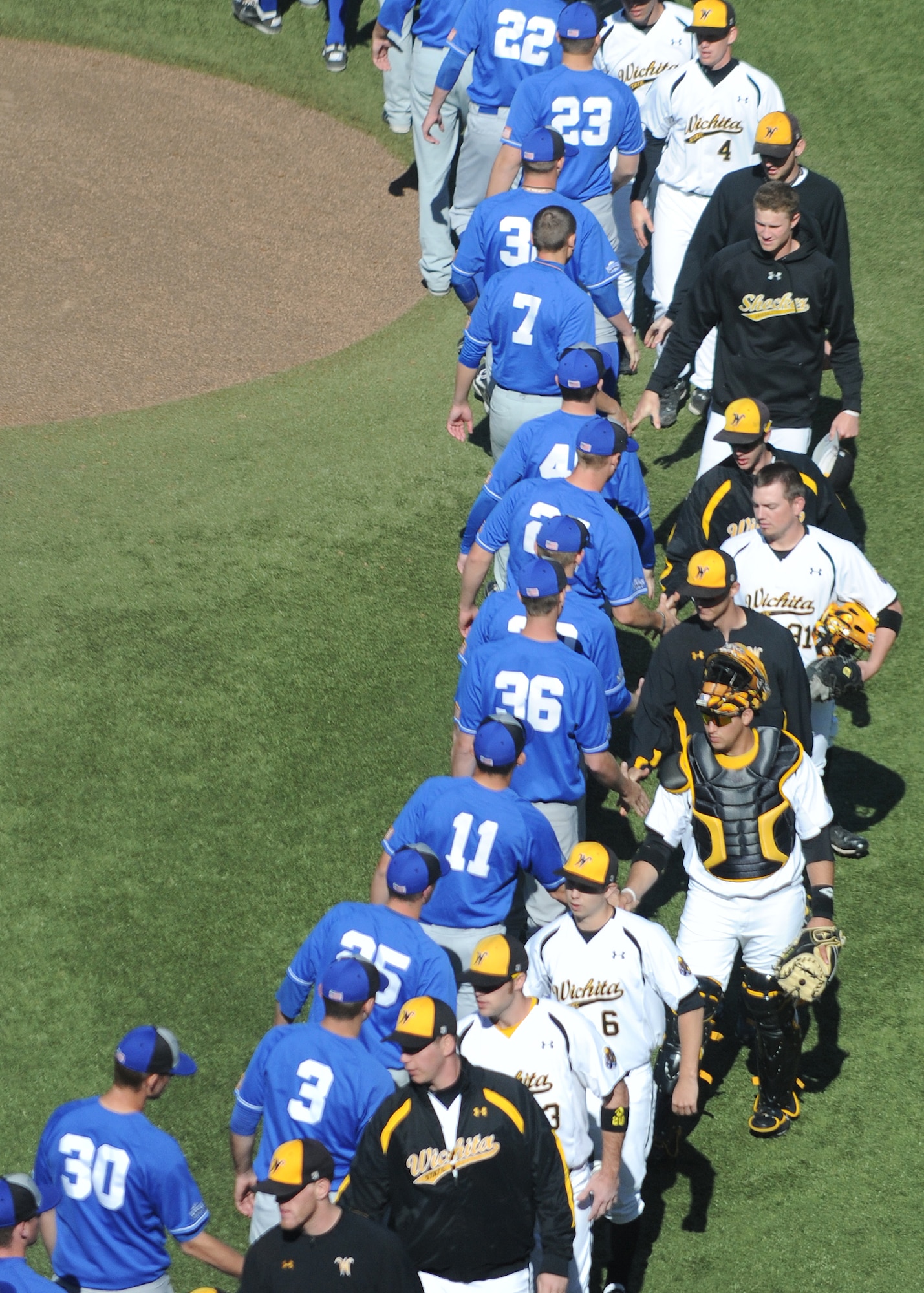 U.S. Air Force Academy Falcons and the Wichita State University Shockers partake in a post-game handshake at Eck Stadium March 23, 2011, Wichita, Kan. The USAFA Falcons lost two games against the WSU Shockers. The losses dropped the Falcons to 11-12 for the season. (U.S. Air Force photo/Airman 1st Class Katrina M. Brisbin)