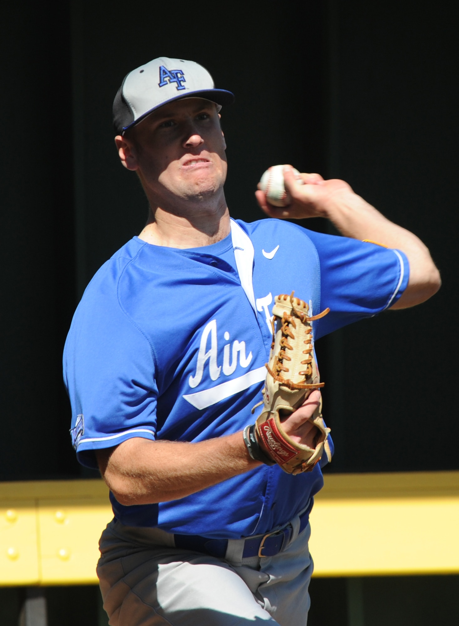 Cadet Third Class Ben Bertelson, U.S. Air Force Academy pitcher, warms his arm up during the Air Force Academy versus Wichita State University baseball game at Eck Stadium March 23, 2011, Wichita, Kan. At the academy, every cadet is considered an athlete and is required to participate at the intercollegiate level, or in intramural program. Both men's and women's programs compete at the NCAA Division I level in the Mountain West Conference year-round. (U.S. Air Force photo/Airman 1st Class Katrina M. Brisbin)
