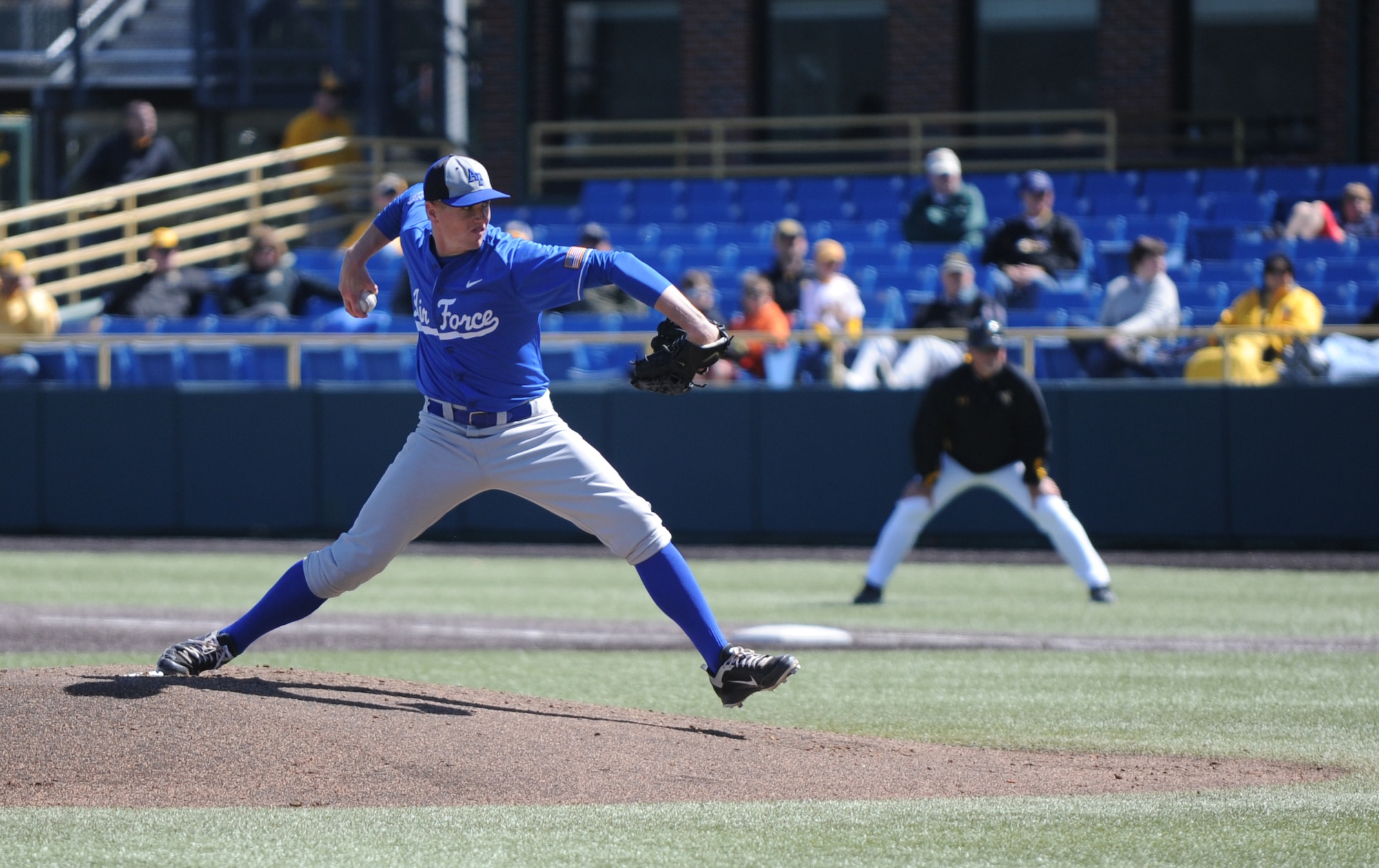 Cadet Fourth Class Cameron White, U.S. Air Force Academy, pitches during the Air Force Academy versus Wichita State University baseball game at Eck Stadium March 23, 2011, Wichita, Kan.  The goals of the Air Force Academy’s athletic program are to enhance the physical conditioning of all cadets, developing the physical skills necessary for officership and teaching leadership in a competitive environment to build character. At the academy, every cadet is considered an athlete and is required to participate at the intercollegiate level, or in intramural program. The USAFA Falcons played two games against the WSU Shockers. (U.S. Air Force photo/Airman 1st Class Katrina M. Brisbin)