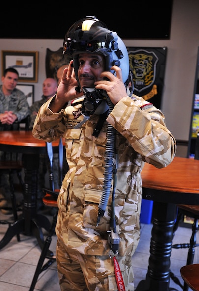 SHAW AIR FORCE BASE, S.C. -- Qatari air force Brig. Gen. Khalifa Saleh al-Naimi wears a Joint Helmeted Mounted Cueing System Helmet at the 79th "Tigers" Fighter Squadron March 28, 2011. Qatar Emiri air force officers toured Shaw Air Force Base, S.C., to see how the installation does its various missions. (U.S. Air Force photo/Airman 1st Class Tabatha Duarte) 