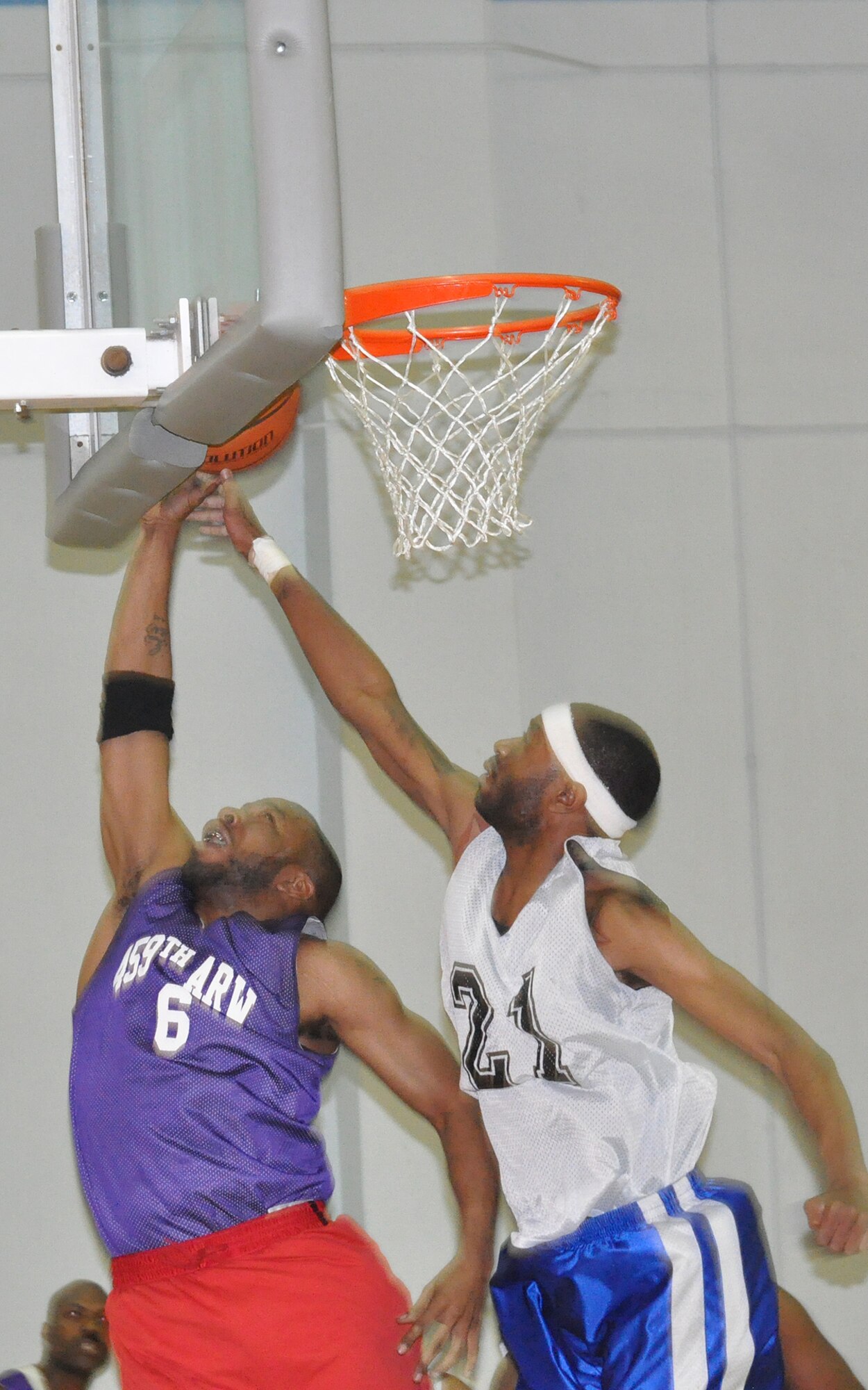JOINT BASE ANDREWS, Md. -- 459th Air Refueling Wing basketball team member, Gino LaGrant, attempts a shot against a d team member from the 11th Civil Engineering Squadron at the East Fitness Center here March 28. The 459 ARW played the 11 CES in a final championship game after winning their regular 2010-2011 season conference. (U.S. Air Force photo/Tech. Sgt. Steve Lewis)