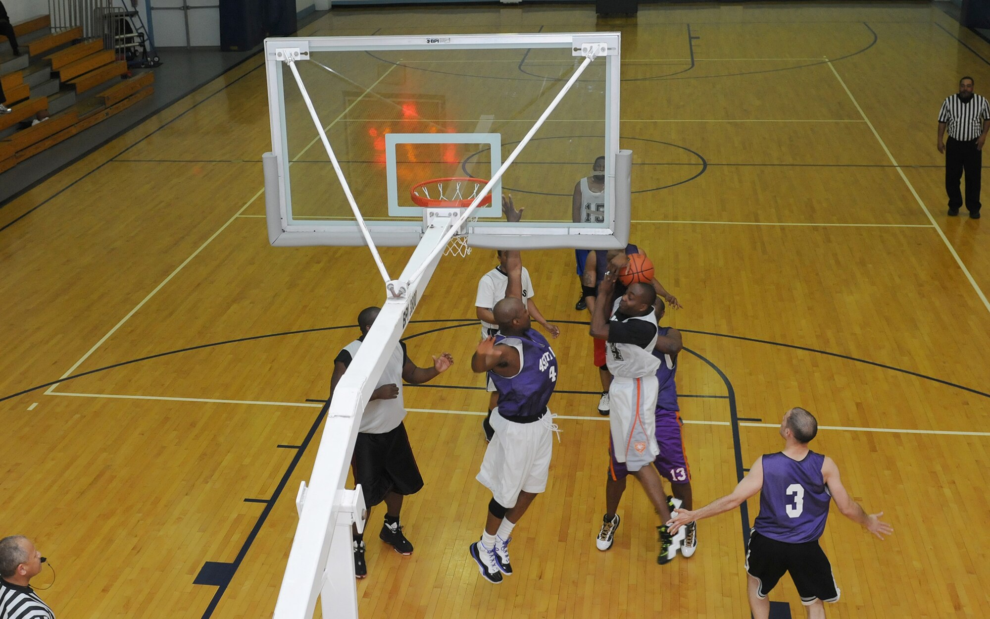 JOINT BASE ANDREWS, Md. -- 459th Air Refueling Wing basketball team captain, Mitchell Barry, blocks a shot from a 11th Civil Engineering Squadron team member at the East Fitness Center here March 28. The 459 ARW played the 11 CES in a final championship game after winning their regular 2010-2011 season conference. (U.S. Air Force photo/Tech. Sgt. Steve Lewis)