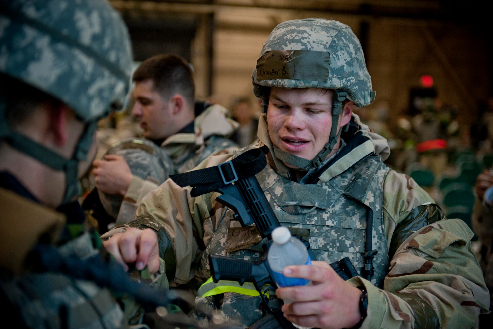 Senior Airman Chandler Kramer, 23rd Security Forces Squadron armourer, checks his wingman?s gear March 30 at an exercise entry point, Moody Air Force Base, Ga. The EEP served as a final chance for Airmen to make any last-second changes to their gear before entering the exercise play area. (U.S. Air Force photo/Staff Sgt. Jamal D. Sutter)(RELEASED)