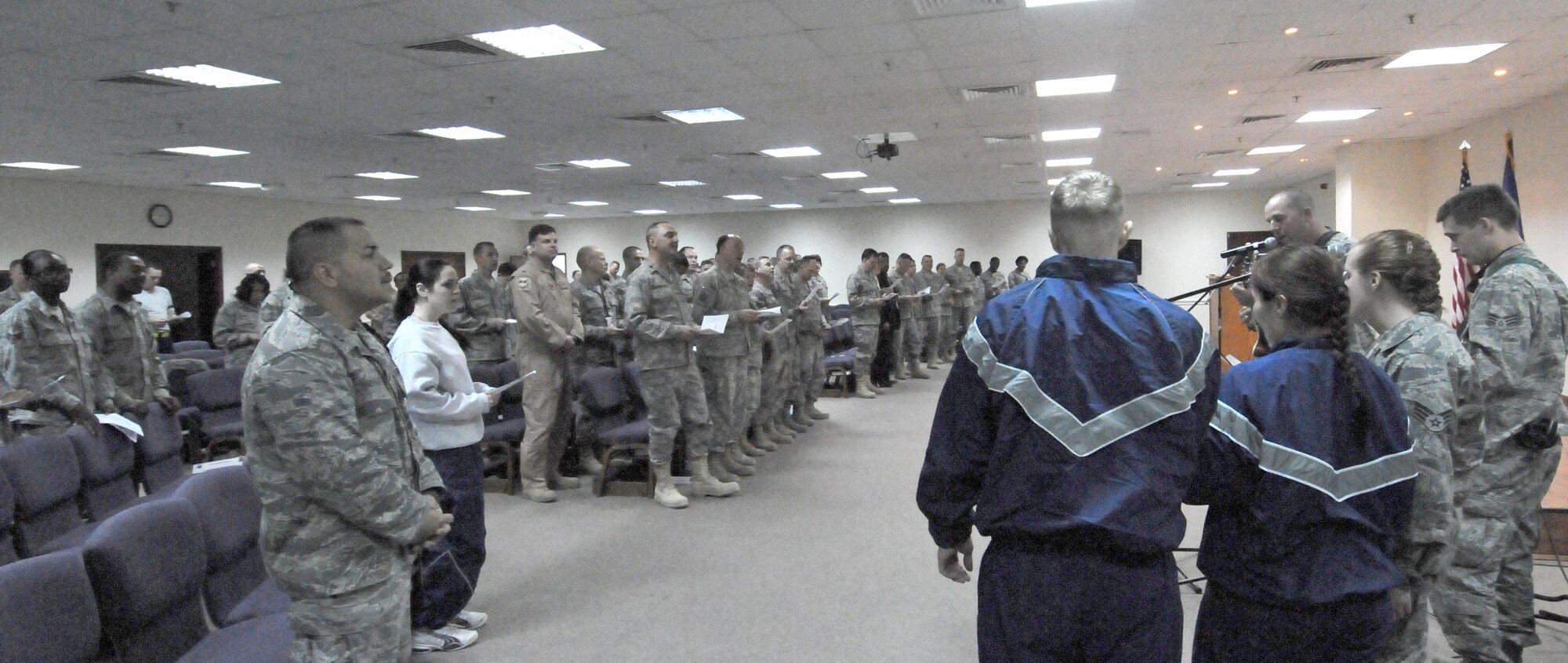 Members of the 386th Air Expeditionary Wing sing a hymn during the National Prayer Breakfast at an undisclosed location in Southwest Asia March 17. The breakfast featured Chaplain (Col.) Brett Oxman, U.S. Air Forces Central Command chaplain, and began at the Desert Winds Dining Facility before migrating to the Rock Chapel. (U.S. Air Force photo by Staff Sgt. Patrice Clarke)