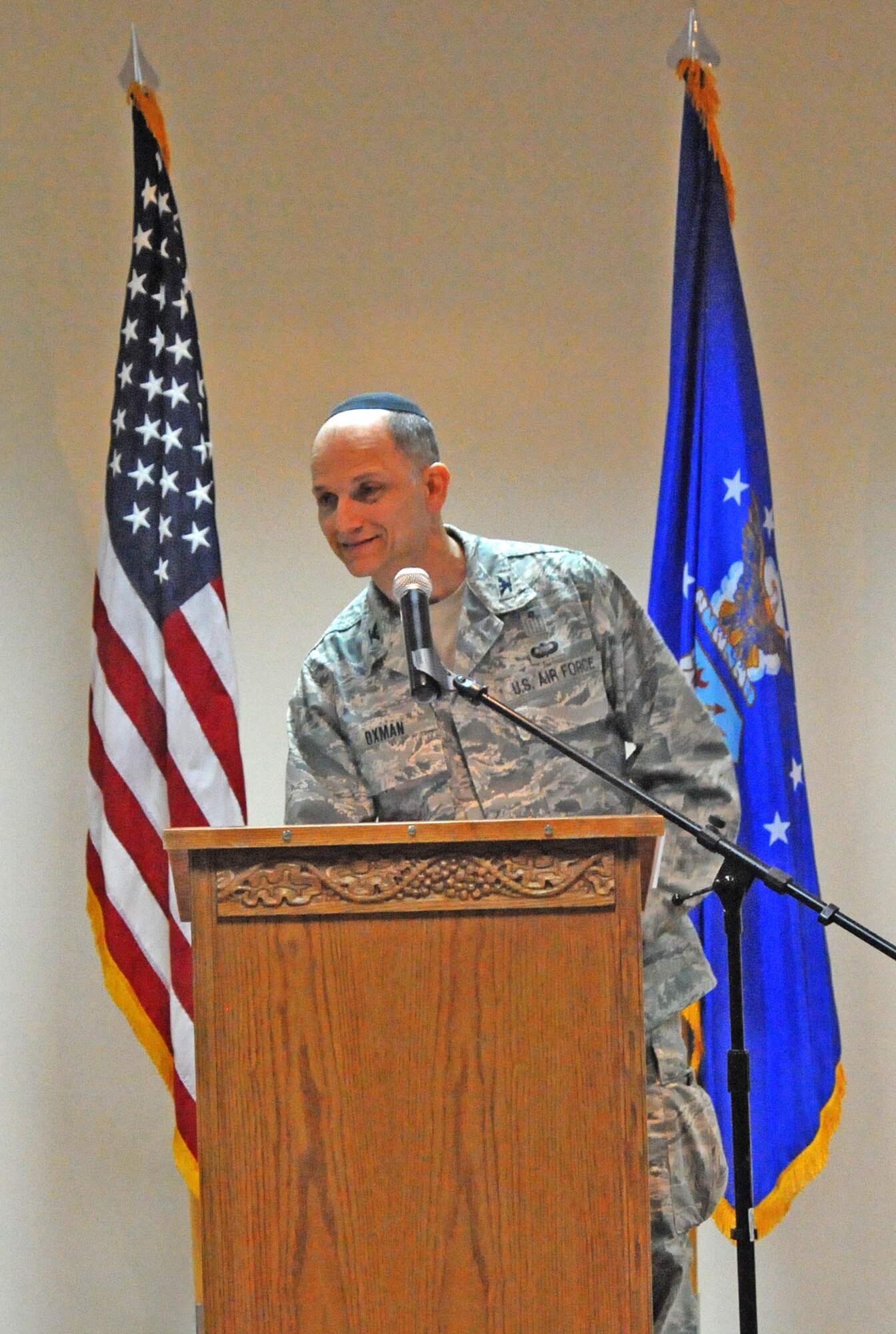 Chaplain (Col.) Brett Oxman, U.S. Air Forces Central Command chaplain, speaks to members of the 386th Air Expeditionary Wing during the Rock Chapel's National Prayer Breakfast March 17, which started at the Desert Winds Dining Facility and migrated to the Rock Chapel. (U.S. Air Force photo by Staff Sgt. Patrice Clarke)