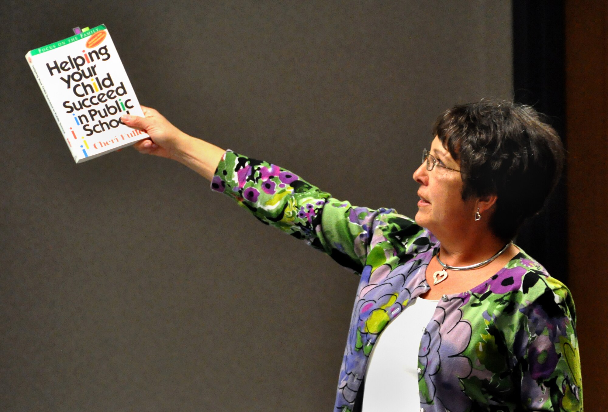 SCOTT AIR FORCE BASE, Ill. -- Linda McNabb displays a book she credits with helping her become a better advocate for her children when they were in school.(Photo by Bob Fehringer)

