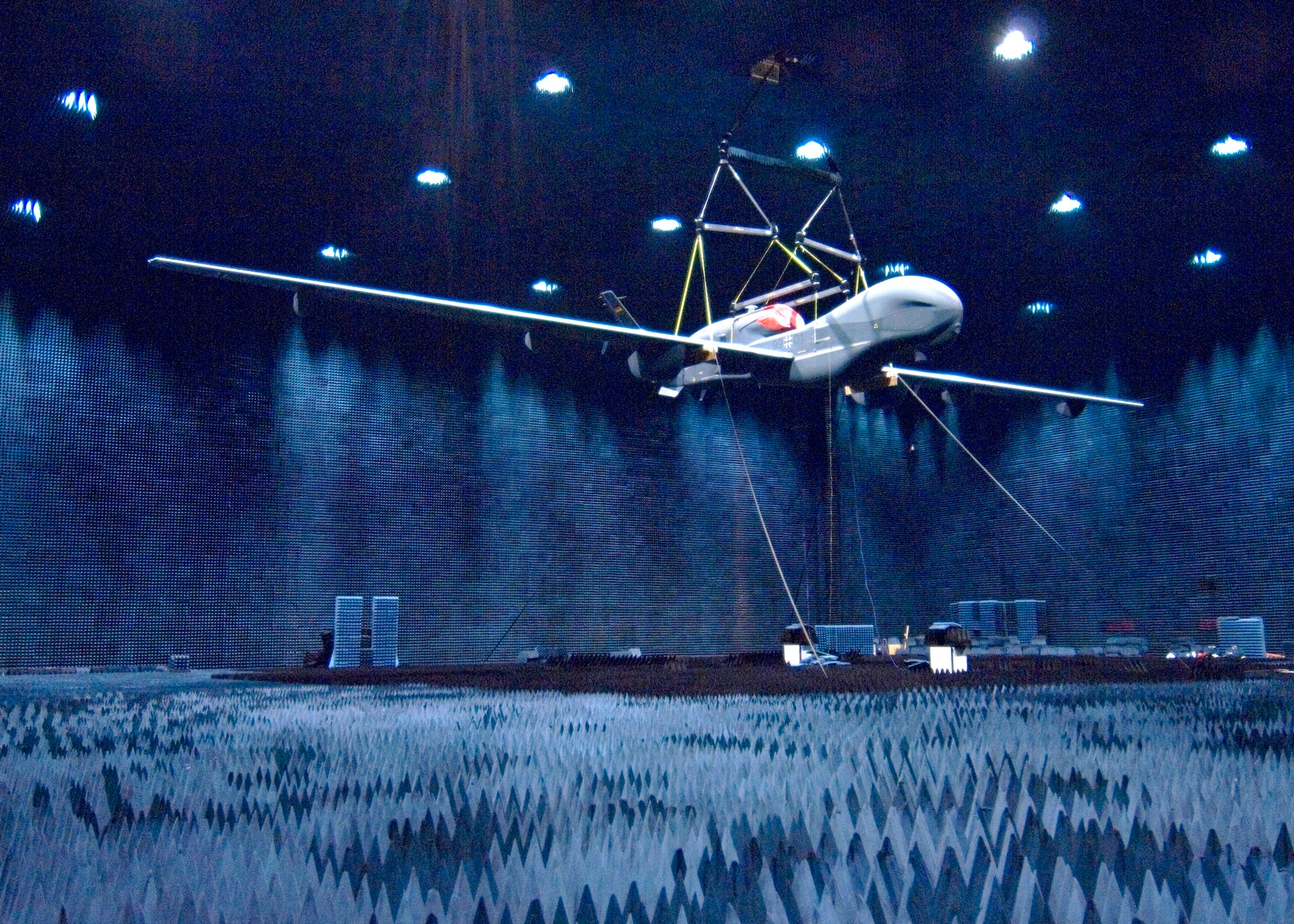 A Northrop Grumman Euro Hawk hangs in the Benefield Anechoic Facility at Edwards March 10. The unmanned aerial vehicle underwent electromagnetic interference testing to see how it may react to electromagnetic fields in Europe. (Air Force photo by Edward Cannon)