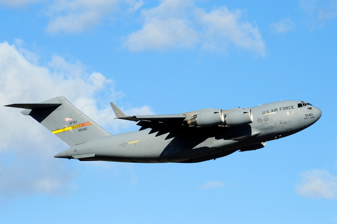 A C-17 Globemaster III takes off March 22, 2011, from Grant County International Airport in Moses Lake, Wash., on a mission in support of Operation Odyssey Dawn. (U.S. Air Force photo/Airman 1st Class Taylor Curry)