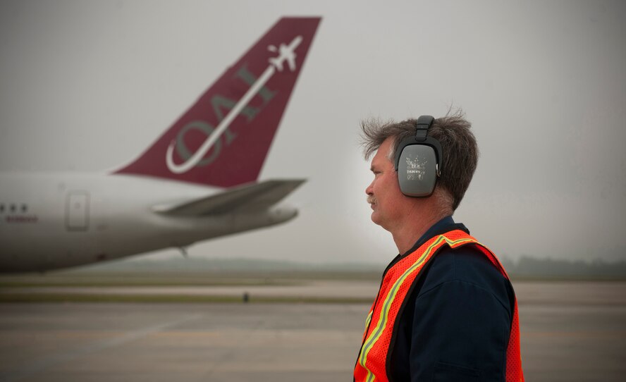 An air traffic controller watches a Boeing 757 pass by as it prepares to park during a homecoming at Moody Air Force Base, Ga., March 29. The aircraft brought back more than 100 Airmen to their families and home station after a six-month deployment. (U.S. Air Force photo/Airman 1st Class Joshua Green)(RELEASED)