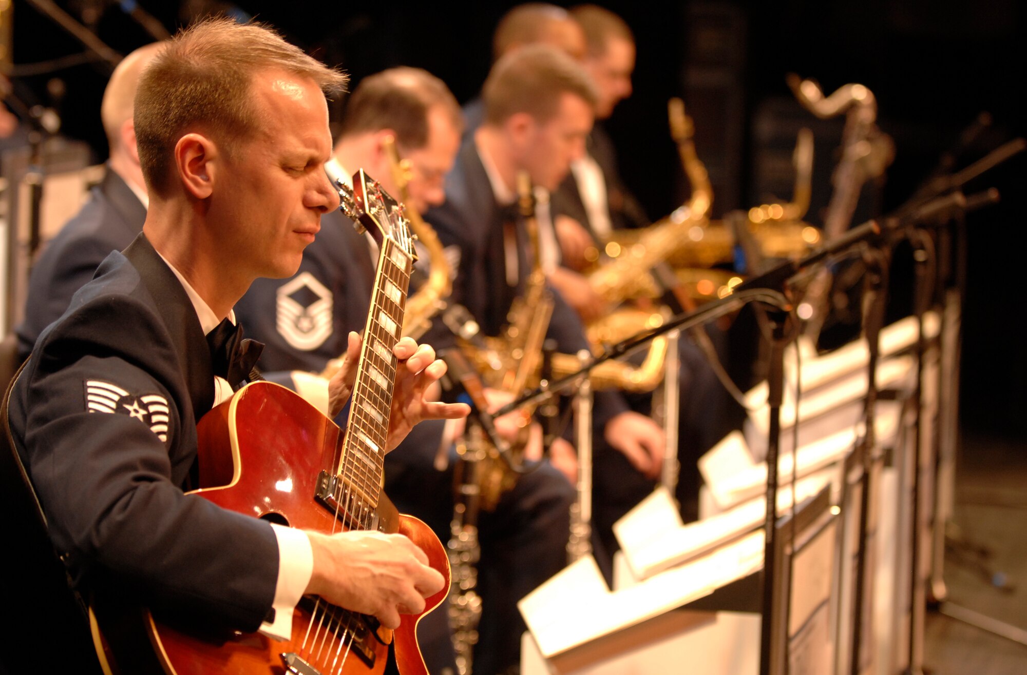 Tech. Sgt. Geoffrey Clay Reecer, guitarist with the Airmen of Note, the premier jazz ensemble of The U.S. Air Force Band, performs March 23 at Vanderbilt University, Nashville, Tenn. The U.S. Air Force Honor Guard's Color Guard travels with The U.S. Air Force Band’s Airmen of Note ensemble to present the colors at each performance. (U.S. Air Force photo by Airman 1st Class Tabitha N. Haynes)