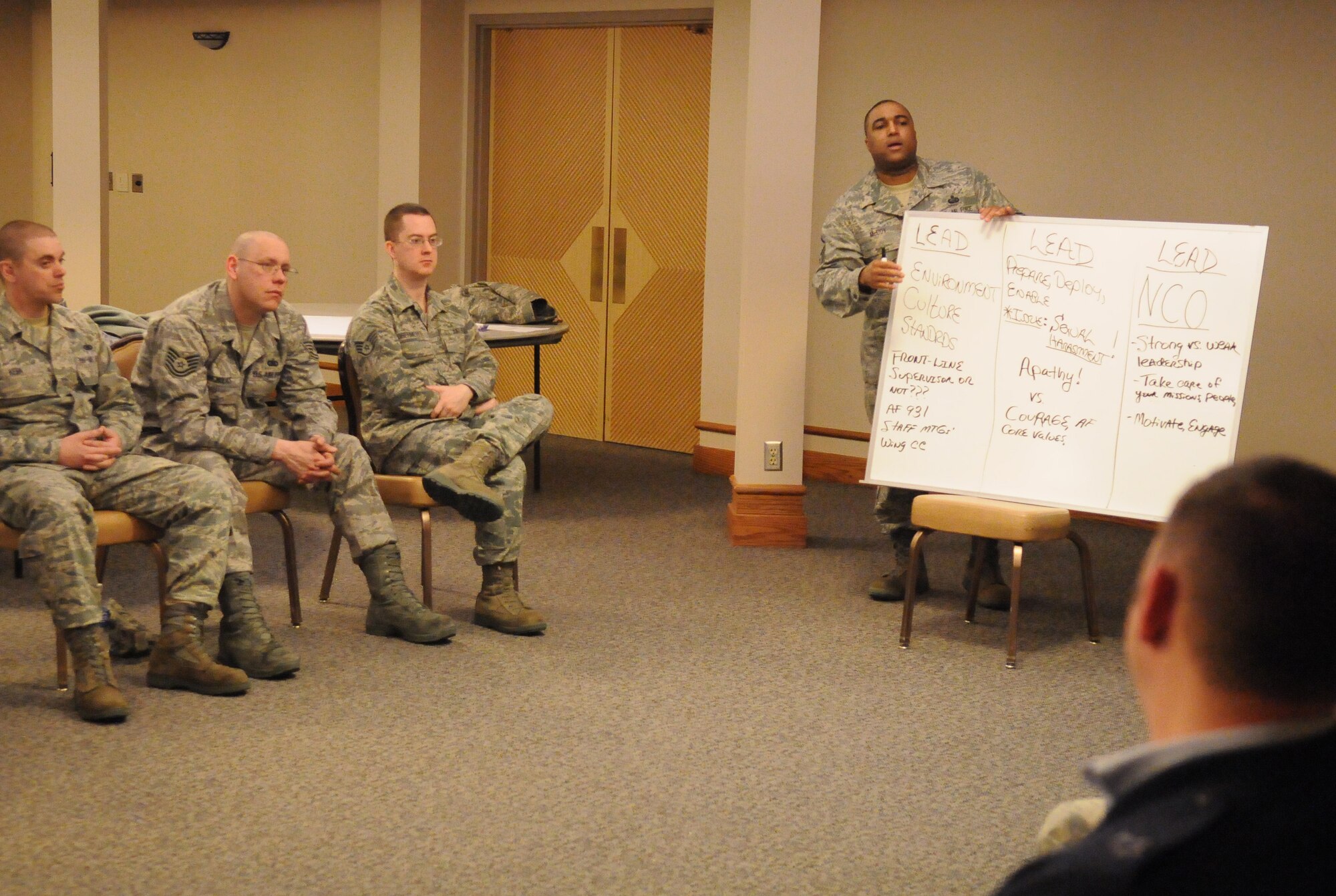 Master Sgt. Michael McCoy leads a discussion at an Equal Opportunity seminar March 21, 2011, Eielson Air Force Base, Alaska. The Equal Opportunity seminar focused on giving E-5's and E-6's the tools to be better NCOs in areas dealing with sexual harassment and unlawful discrimination in the workplace. Sergeant McCoy is the 354th Fighter Wing Equal Opportunities office superintendent. (U.S. Air Force photo/ Airman 1st Class Janine Thibault)