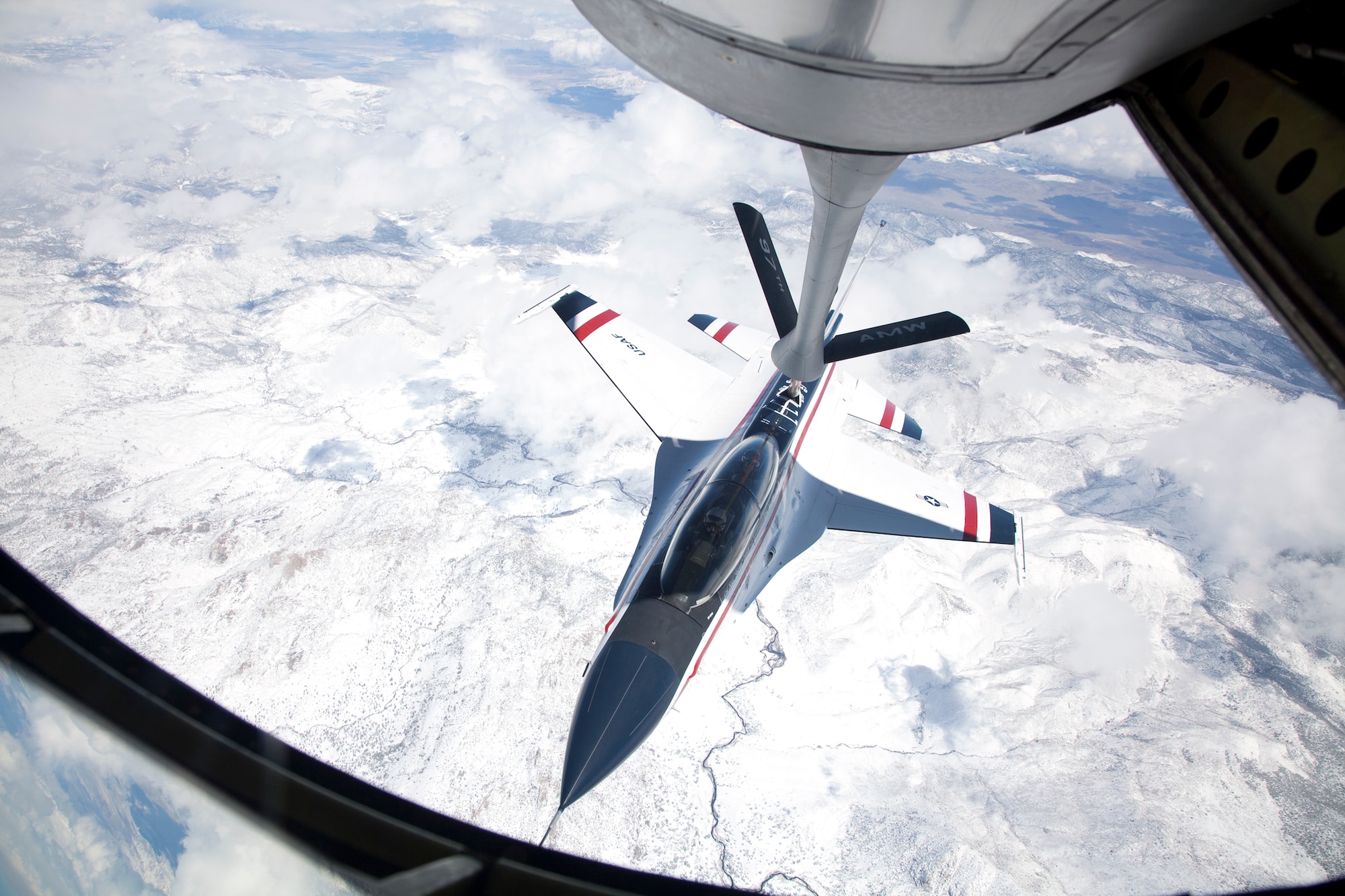 The view from a KC-135 tanker from Altus Air Force Base, Okla., while the United States Air Force Test Pilot School’s VISTA (Variable stability In-flight Simulator Test Aircraft) F-16 connects to the boom during a flight test March 17. The maneuver is part of the Basic Envelope Air Refueling Control Laws, or BEAR CLAW, test project, which is aimed at obtaining preliminary data leading ultimately to have an unmanned aerial vehicle conduct air-to-air refueling. (Air Force photo by Bobbi Zapka)