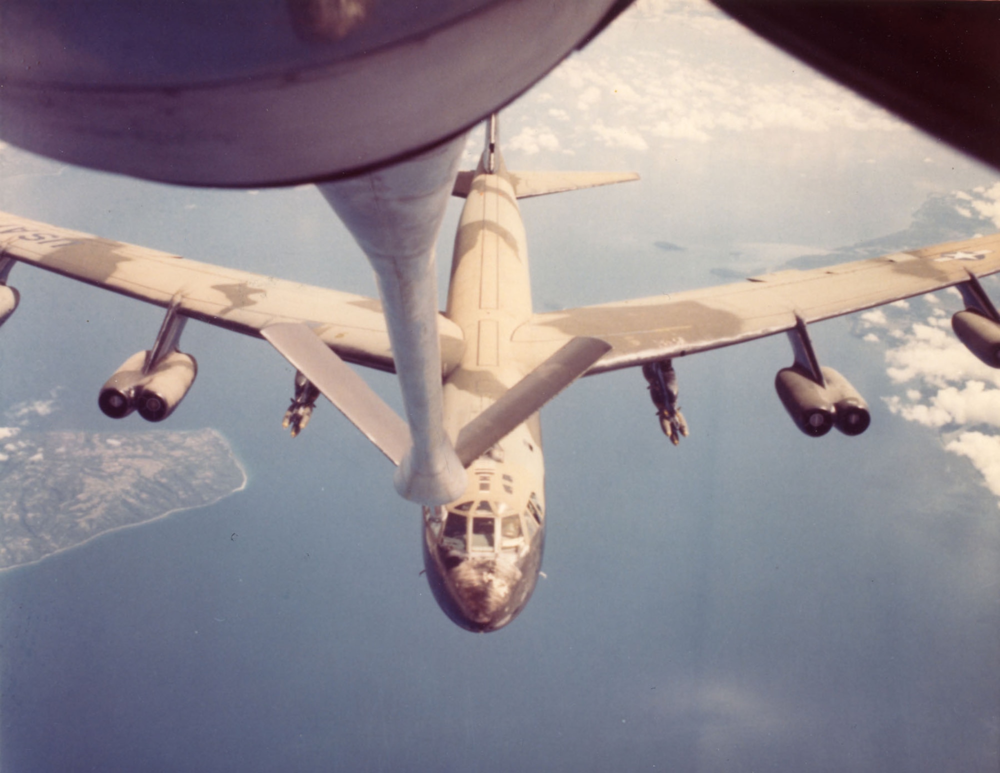 A B-52 refuels over Southeast Asia in 1967. Refueling bombers over vast expanses of ocean required precise navigation and planning. (U.S. Air Force photo)