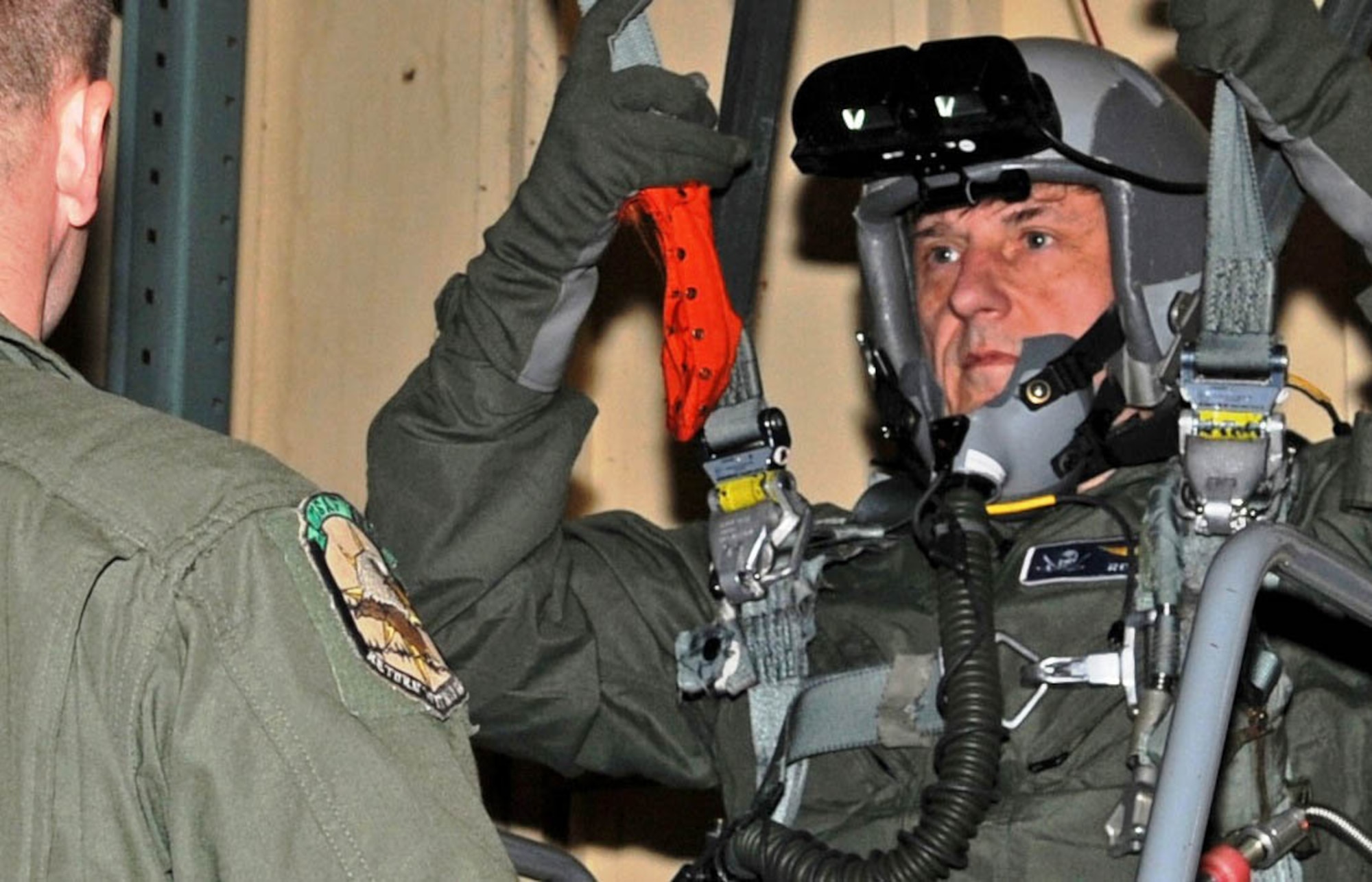 A Survival, Evasion, Resistance and Escape specialist guides Congressman John C. Fleming through life support training at Barksdale Air Force Base, La., March 24, before his orientation flight on a B-52H Stratofortress March 25. Life support training includes local area survival, emergency parachute training and emergency egress training. (U.S. Air Force photo/Senior Airman Alexandra M. Boutte)(RELEASED)
