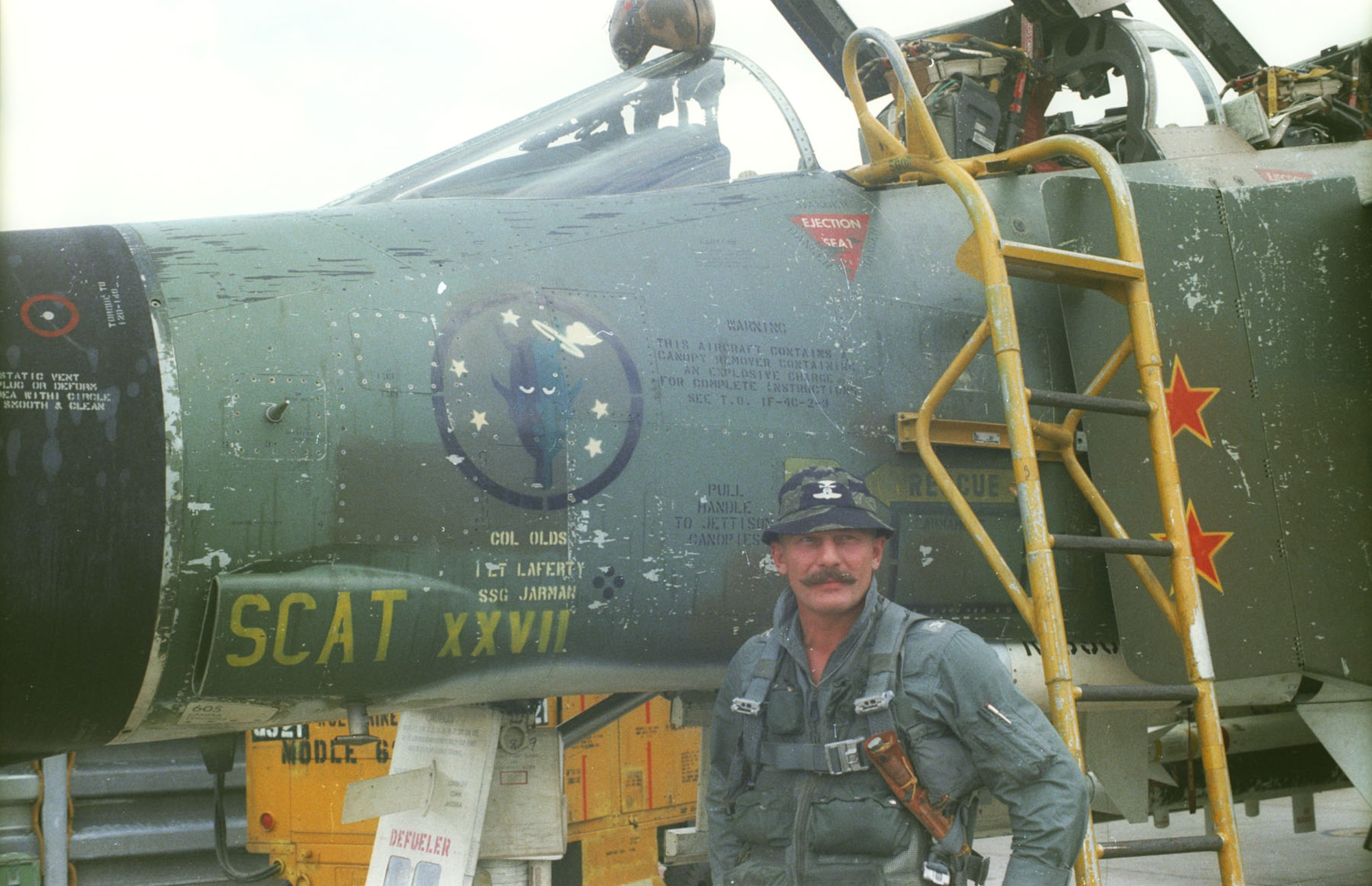 Col. Robin Olds with his F-4C SCAT XXVII, which is on display at the National Museum of the U.S. Air Force. Olds named all his aircraft after his West Point roommate Scat Davis, who could not become a military pilot due to poor eyesight. (U.S. Air Force photo)