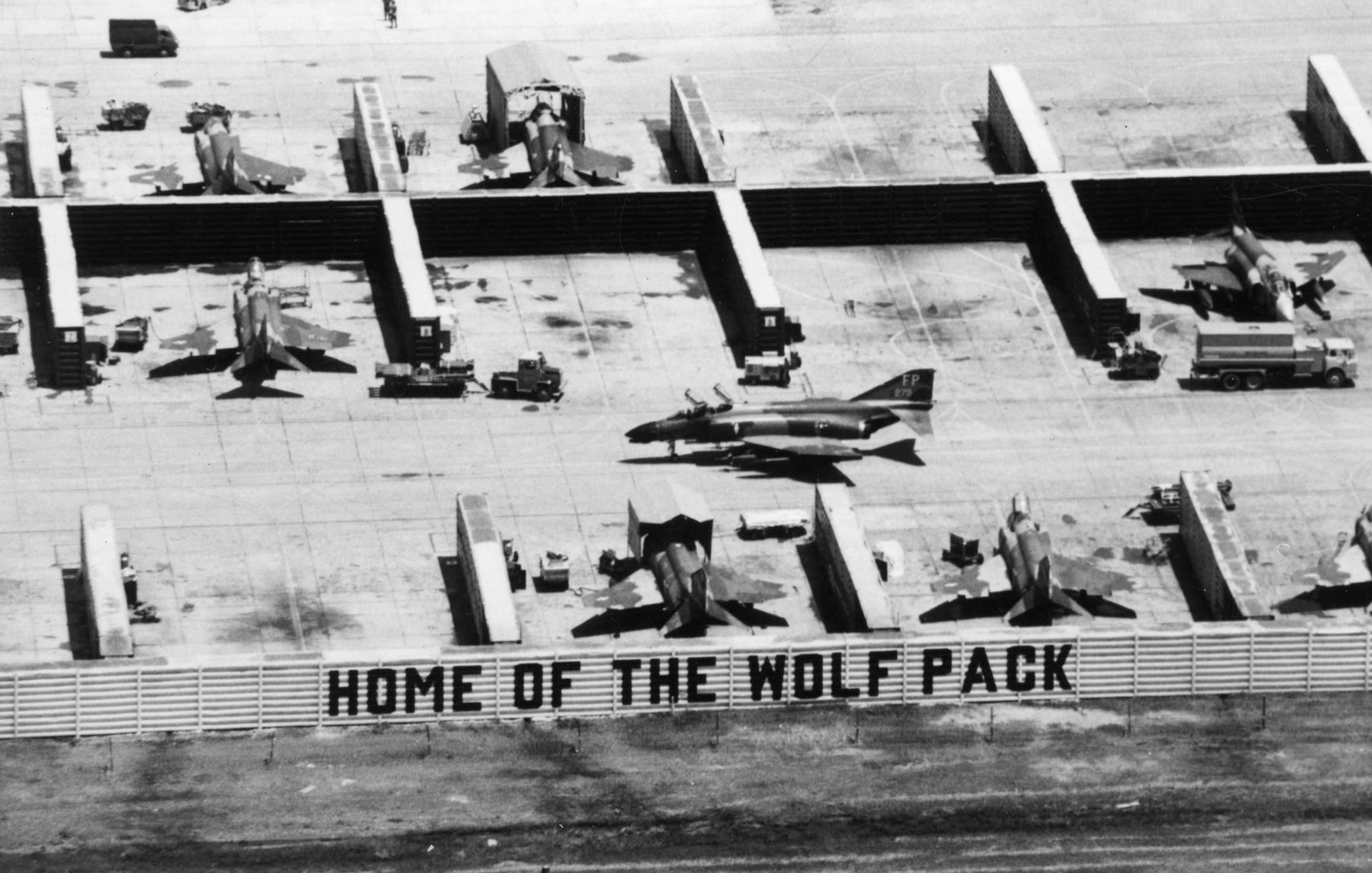 The nickname of the 8th Tactical Fighter Wing -- the “Wolfpack” -- fit Robin Olds’ aggressive style. Pictured here are revetments and F-4s of the 8th TFW at Ubon, Thailand. (U.S. Air Force photo)