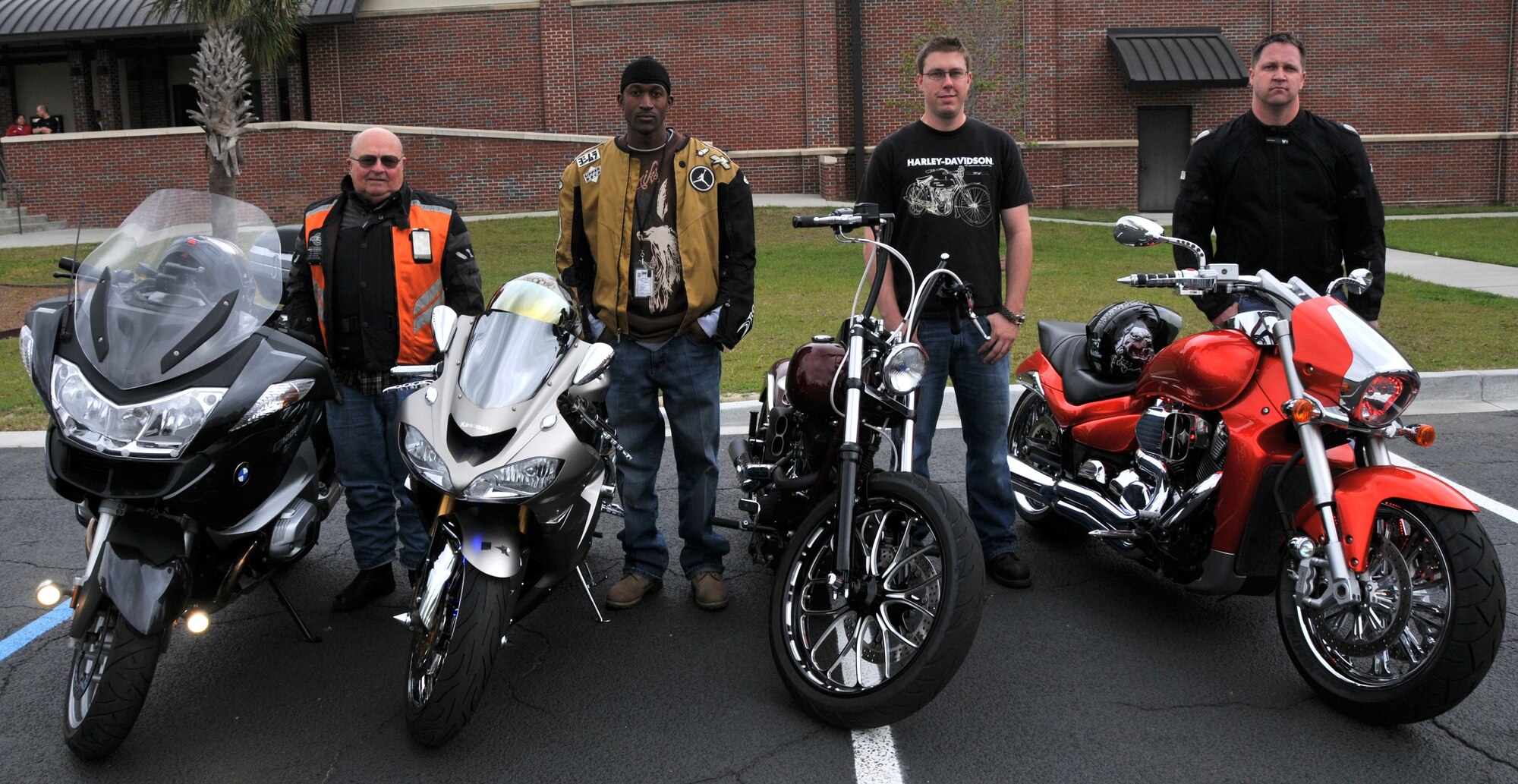 Louis Pechon, Staff Sgt. Marcus Perkins, Petty Officer 3rd Class Christopher Evans and Tech. Sgt. Darrel Blake pose for a group photo after being declared winners of the bike show during the 2011 Joint Base Charleston Motorcycle Safety Event March 25 at the JB CHS - Air Base theater. Mr. Pechon, from Cape Fox, won the sport touring bike category. Sergeant Perkins, from the 628th Security Forces Squadron, won the sport bike category. Petty Officer Evans, from the Navy Munitions Command, won the custom bike category and Sergeant Blake, from the 437th Aerial Port Squadron, won the standard bike category. (U.S. Air Force photo/Airman 1st Class Jared Trimarchi)
