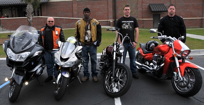 Louis Pechon, Staff Sgt. Marcus Perkins, Petty Officer 3rd Class Christopher Evans and Tech. Sgt. Darrel Blake pose for a group photo after being declared winners of the bike show during the 2011 Joint Base Charleston Motorcycle Safety Event March 25 at the JB CHS - Air Base theater. Mr. Pechon, from Cape Fox, won the sport touring bike category. Sergeant Perkins, from the 628th Security Forces Squadron, won the sport bike category. Petty Officer Evans, from the Navy Munitions Command, won the custom bike category and Sergeant Blake, from the 437th Aerial Port Squadron, won the standard bike category. (U.S. Air Force photo/Airman 1st Class Jared Trimarchi)
