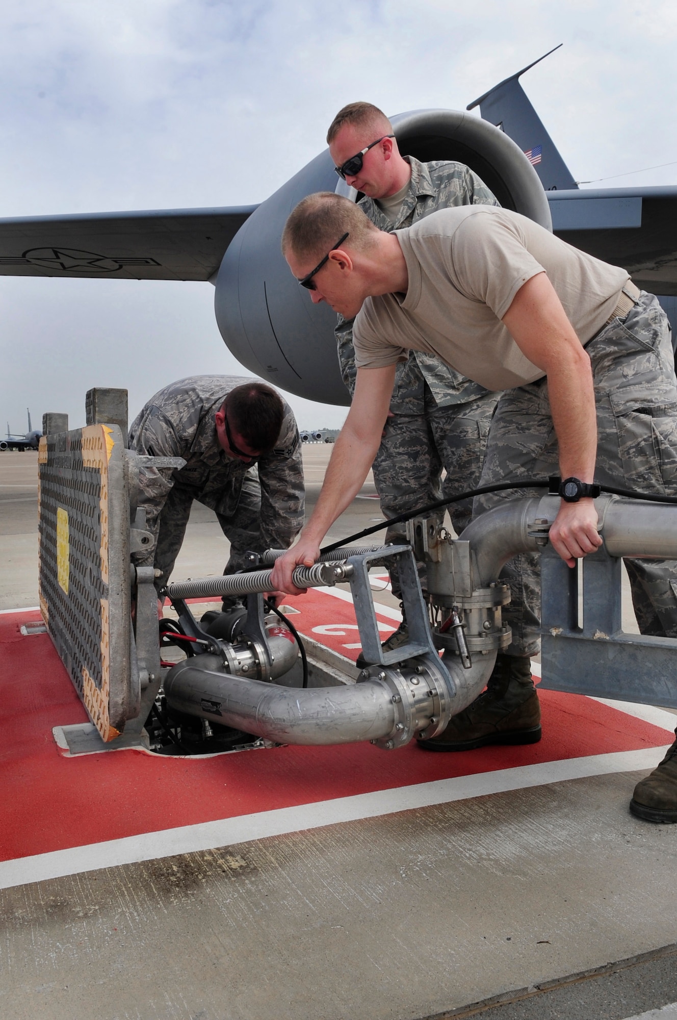 313th AIR EXPEDITIONARY WING -- Airmen from the 100th Logistics Readiness Squadron work a pantograph into place to attach it to an underground fuel source to refuel a KC-135 Stratotanker in support of Joint Task Force Odyssey Dawn March 25. Joint Task Force Odyssey Dawn is the U.S. Africa Command task force established to provide operational and tactical command and control of U.S. military forces supporting the international response to the unrest in Libya and enforcement of United Nations Security Council Resolution (UNSCR) 1973. UNSCR 1973 authorizes all necessary measures to protect civilians in Libya under threat of attack by Gadhafi regime forces. JTF Odyssey Dawn is commanded by U.S. Navy Admiral Samuel J. Locklear, III. (U.S. Air Force photo/Senior Airman Ethan Morgan)