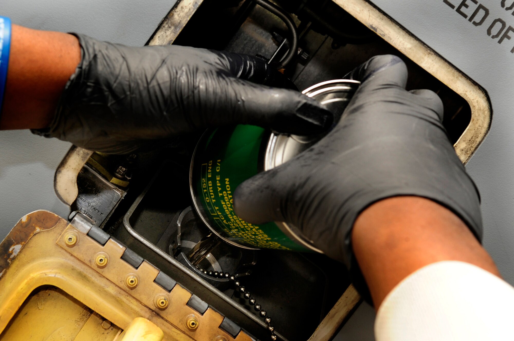 313TH AIR EXPEDITIONARY WING -- Engine oil is added to a KC-135 Stratotanker engine March 25 during the current ongoing mission in support of Joint Task Force Odyssey Dawn. Joint Task Force Odyssey Dawn is the U.S. Africa Command task force established to provide operational and tactical command and control of U.S. military forces supporting the international response to the unrest in Libya and enforcement of United Nations Security Council Resolution (UNSCR) 1973. UNSCR 1973 authorizes all necessary measures to protect civilians in Libya under threat of attack by Gadhafi regime forces. JTF Odyssey Dawn is commanded by U.S. Navy Admiral Samuel J. Locklear, III. (U.S. Air Force photo/Senior Airman Ethan Morgan)